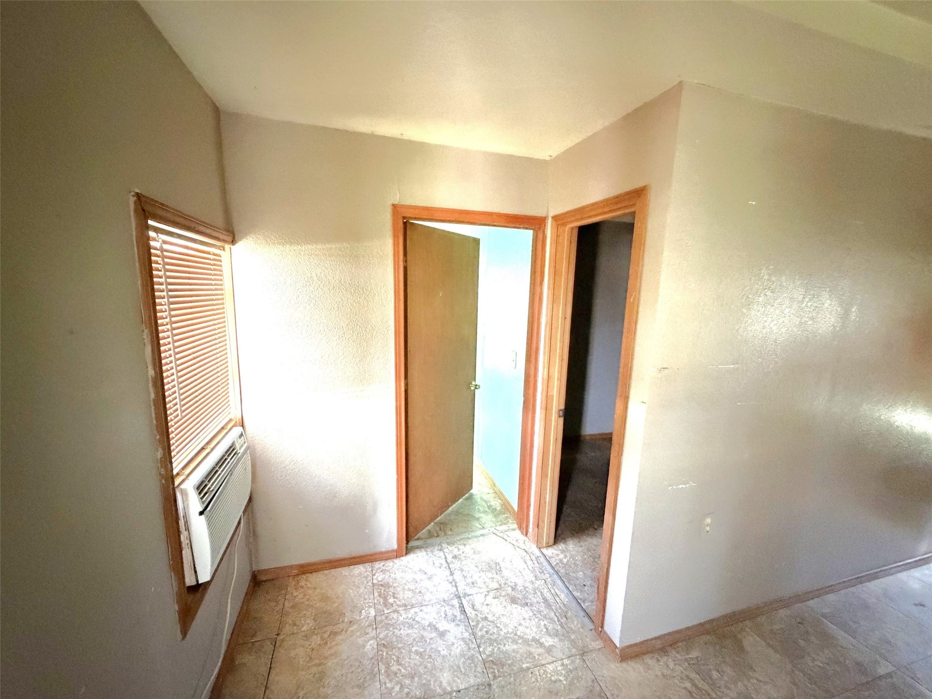 209 S Avenue C, Freeport, TX 77541 To the left of the front door are the bedrooms.