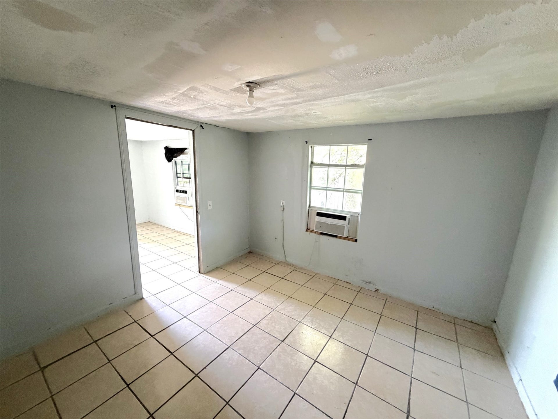 209 S Avenue C, Freeport, TX 77541 The bedroom of the second house is off the living area.