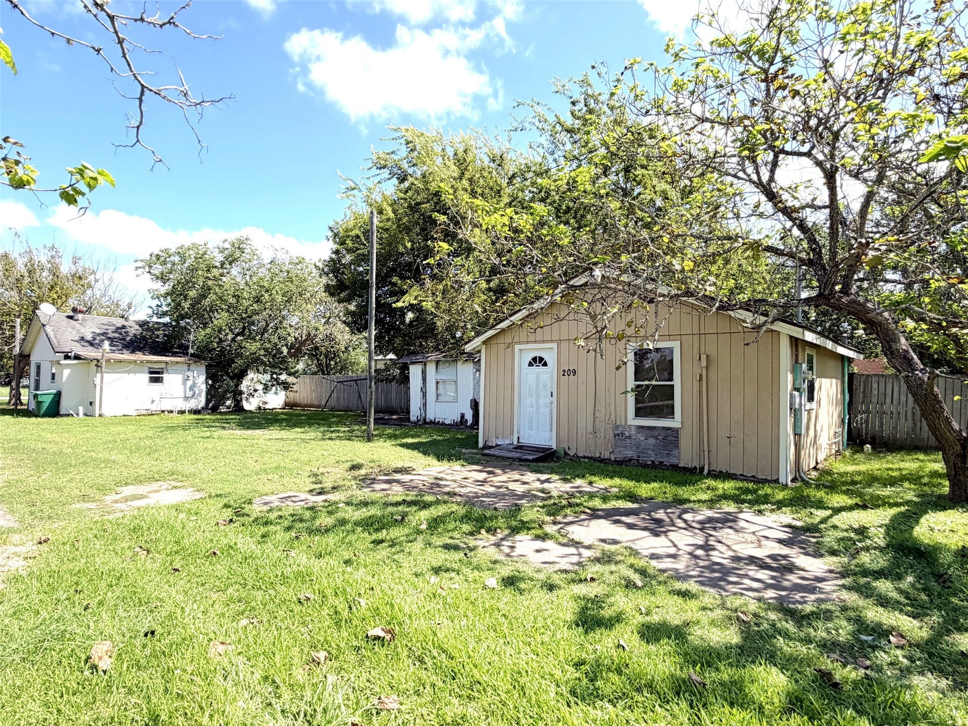 209 S Avenue C, Freeport, TX 77541 Welcome to 209 S Ave C! This spacious corner lot hold two houses and a pad for either a third or an RV. What a great deal!