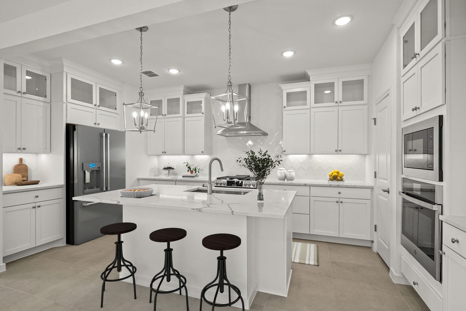 Stunning kitchen with stacked cabinets and quartz counters (*Photo not of actual home and used for illustration purposes only.)