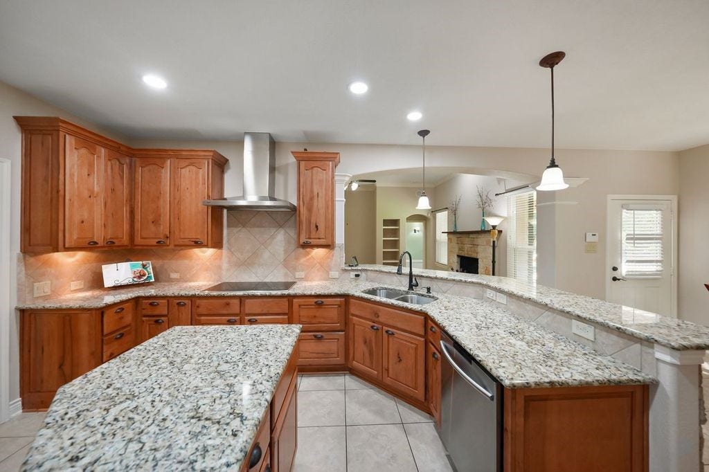 28235 Lazy Rock Drive, Houston, TX 77336 Gleaming granite countertops, upgraded cabinets and breakfast bar