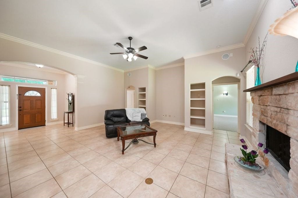 28235 Lazy Rock Drive, Houston, TX 77336 From Living Room with arched entry to Primary Bedroom