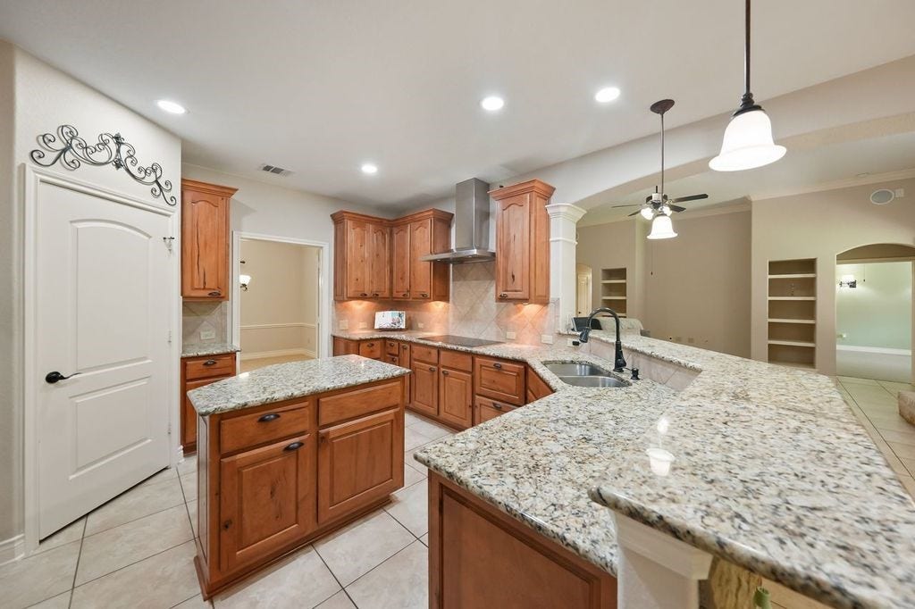28235 Lazy Rock Drive, Houston, TX 77336 Walk-in pantry and lots of lights in kithen