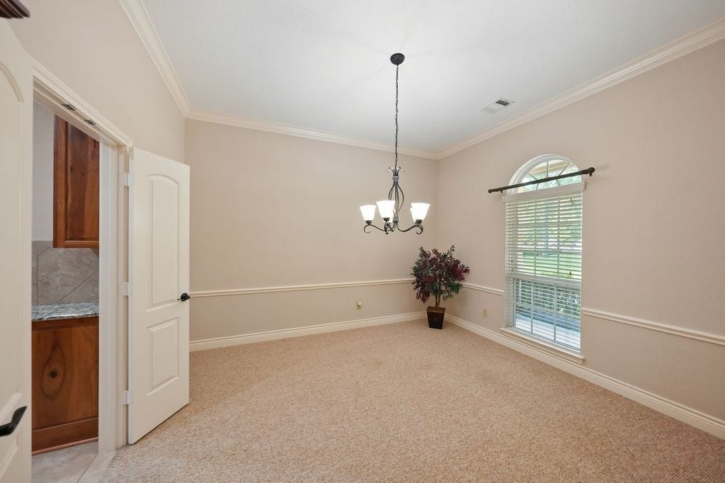 28235 Lazy Rock Drive, Houston, TX 77336 Formal dining room with door to kitchen