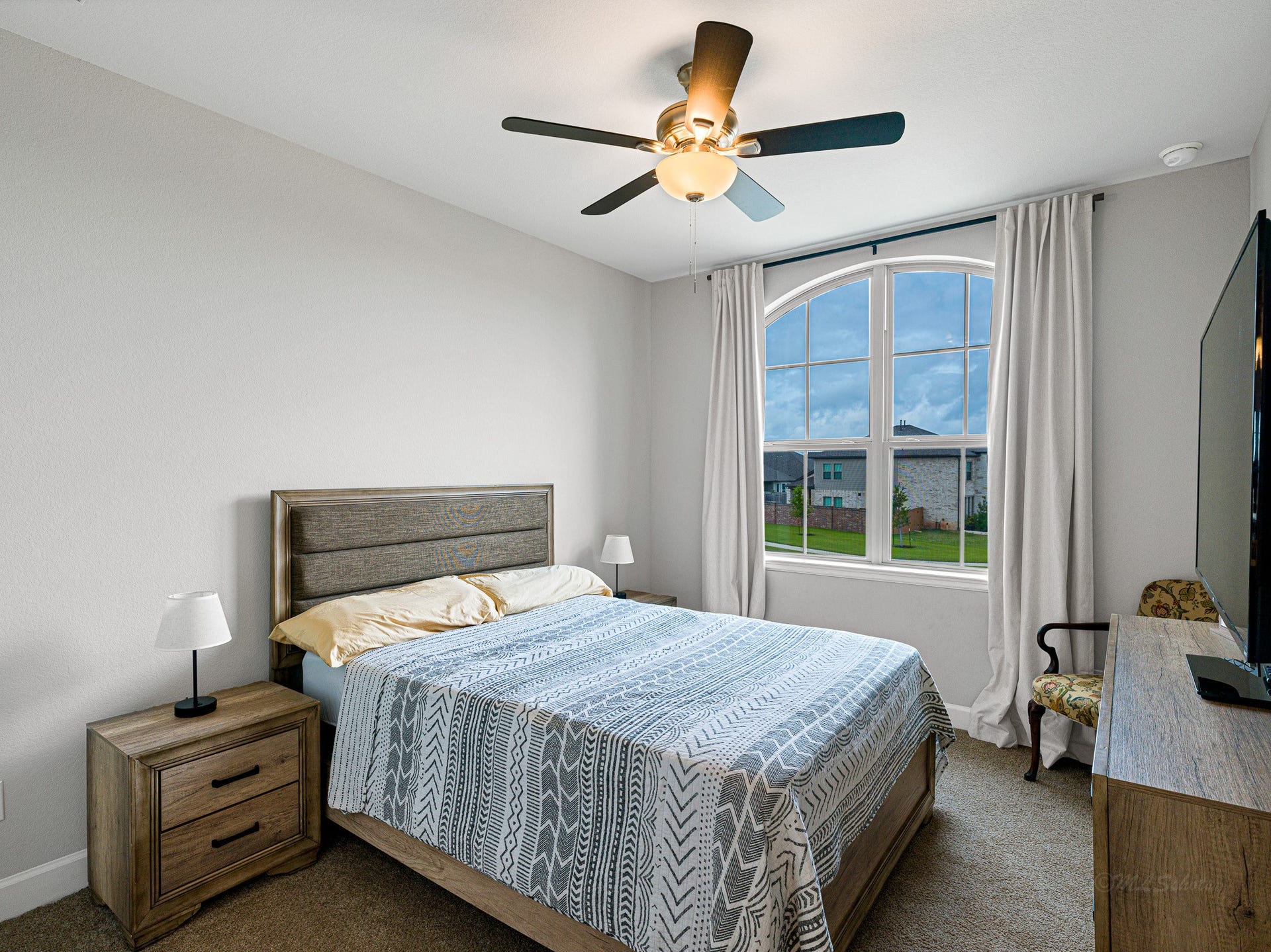 608 Malibu Pines Drive, Katy, TX 77493 Upstairs front bedroom has walk-in closet and added fan.