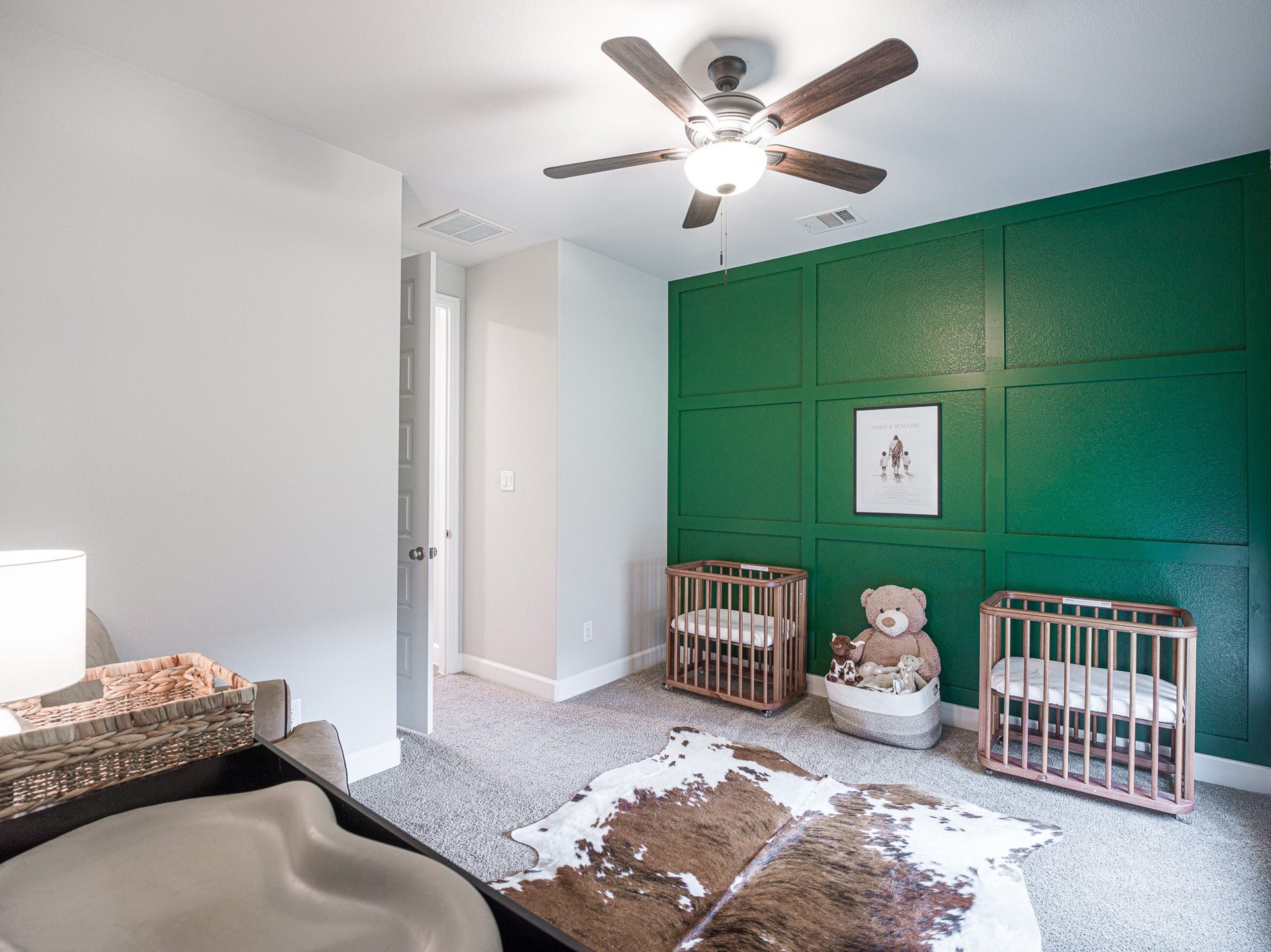 608 Malibu Pines Drive, Katy, TX 77493 Downstairs secondary bedroom - no need to go upstairs! Green accent wall and ceiling fan were added.
