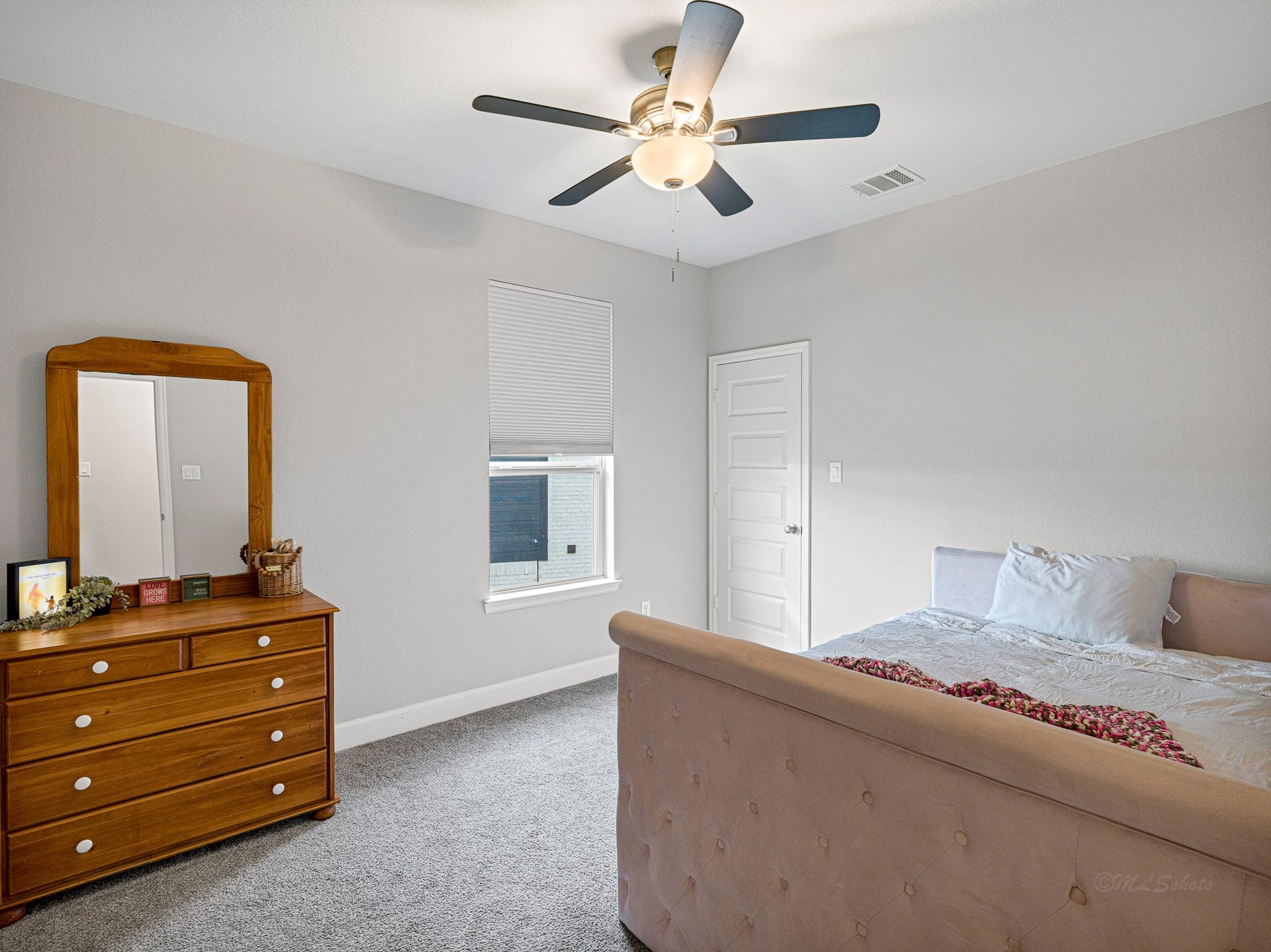 608 Malibu Pines Drive, Katy, TX 77493 Upstairs bedroom has walk-in closet with locked attic access door for additional storage space.