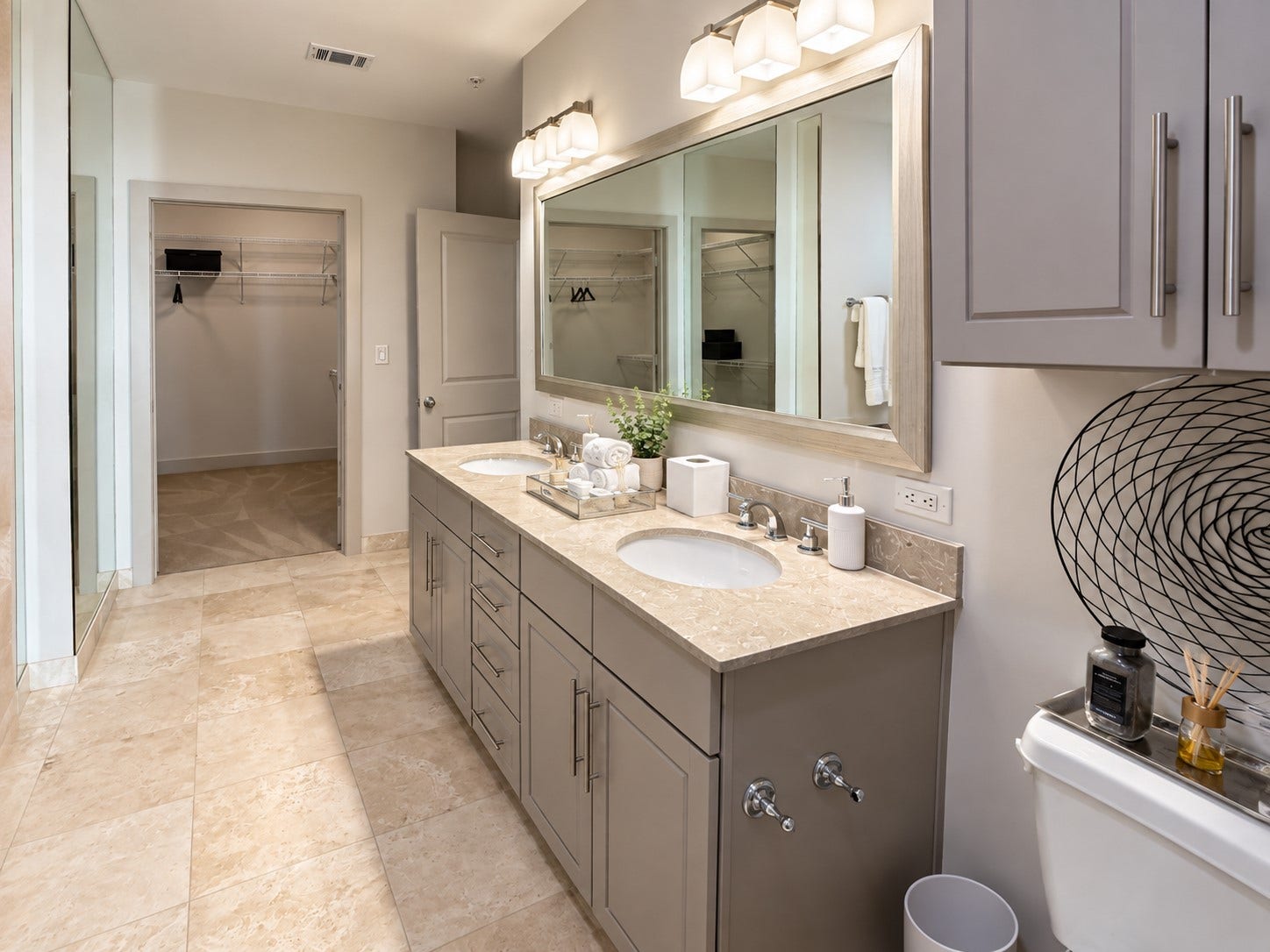 1400 McKinney Street, #1309, Houston, TX 77010 Getting ready doesnt have to feel rushed when you have this much room to yourself. The generous vanity, beautiful stone finishes and soft lighting create a calm, polished space to begin and end your day.