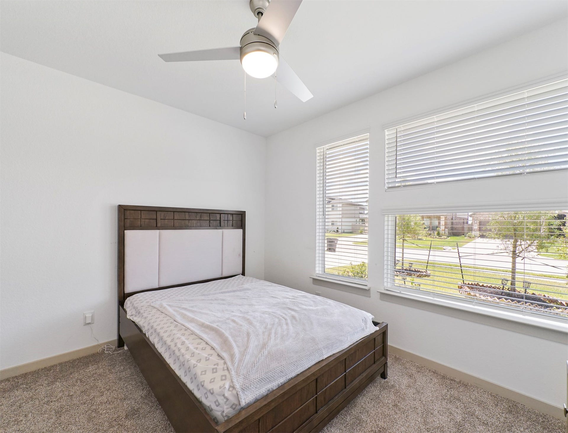 28226 Hazel Trail, Katy, TX 77494 Sunlight pours through oversized windows in this front-facing secondary bedroom, creating an airy, open feel with views of the landscaped front yard.