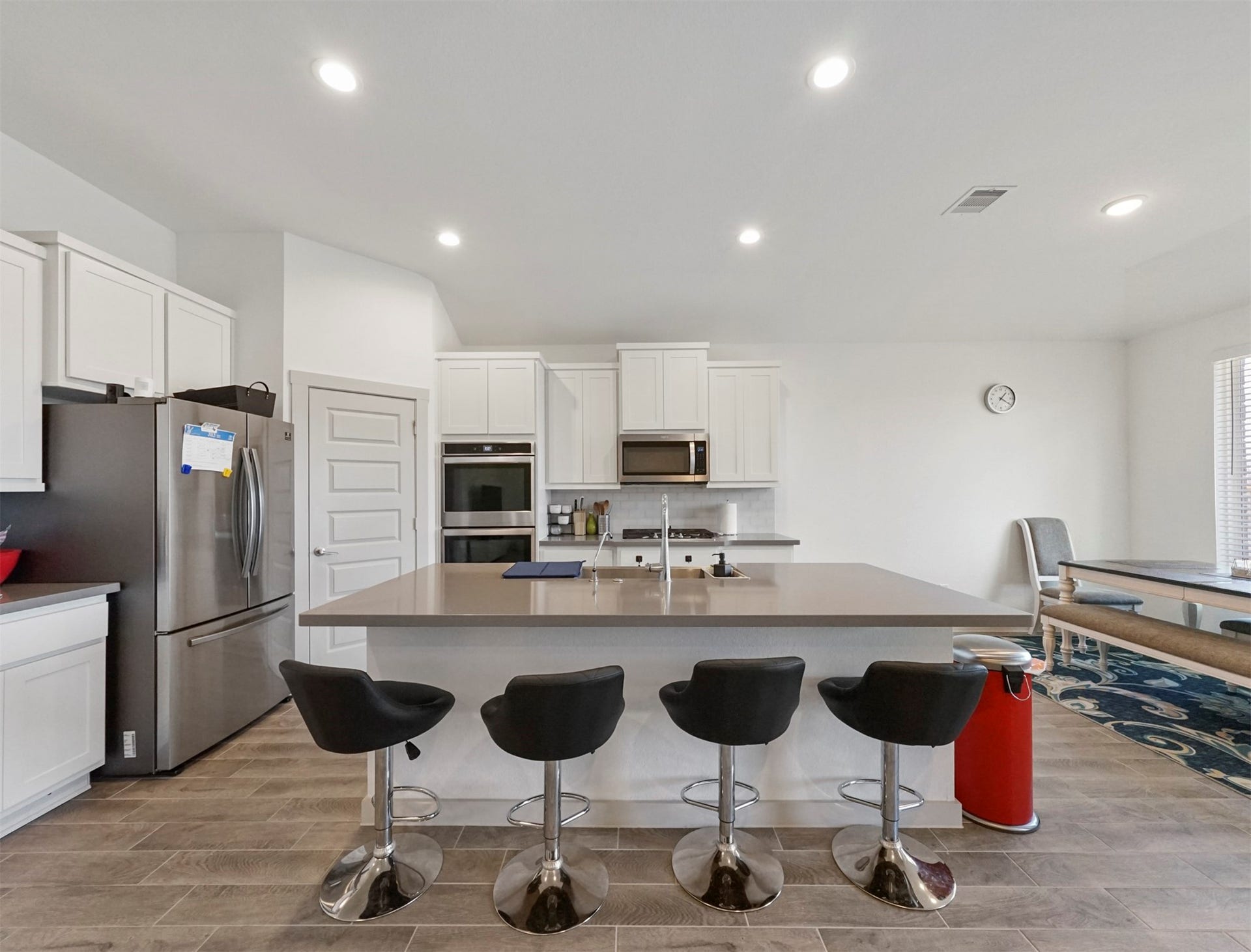 28226 Hazel Trail, Katy, TX 77494 The kitchen is anchored by a large island with durable countertops and seating space. Its surrounded by white shaker cabinetry and stainless steel double wall ovens.