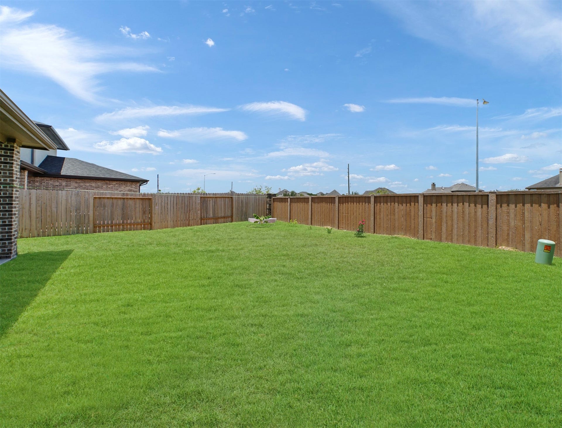 28226 Hazel Trail, Katy, TX 77494 A broad stretch of lawn is enclosed by privacy fencing, leaving plenty of room to garden, relax, or entertain outdoors.