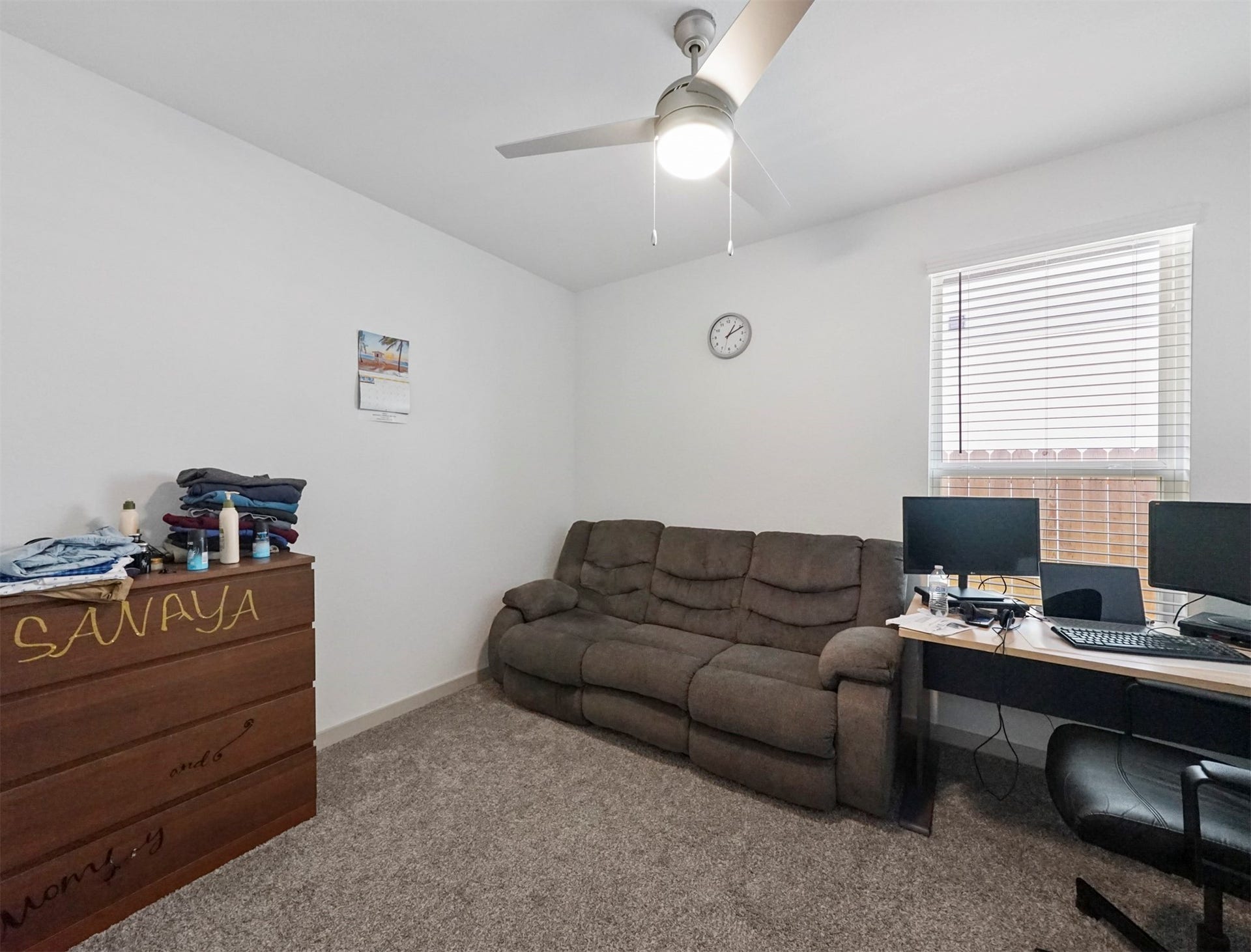 28226 Hazel Trail, Katy, TX 77494 This comfortable secondary bedroom offers plush carpet, a ceiling fan with light, and a generous window that brings in soft natural light.