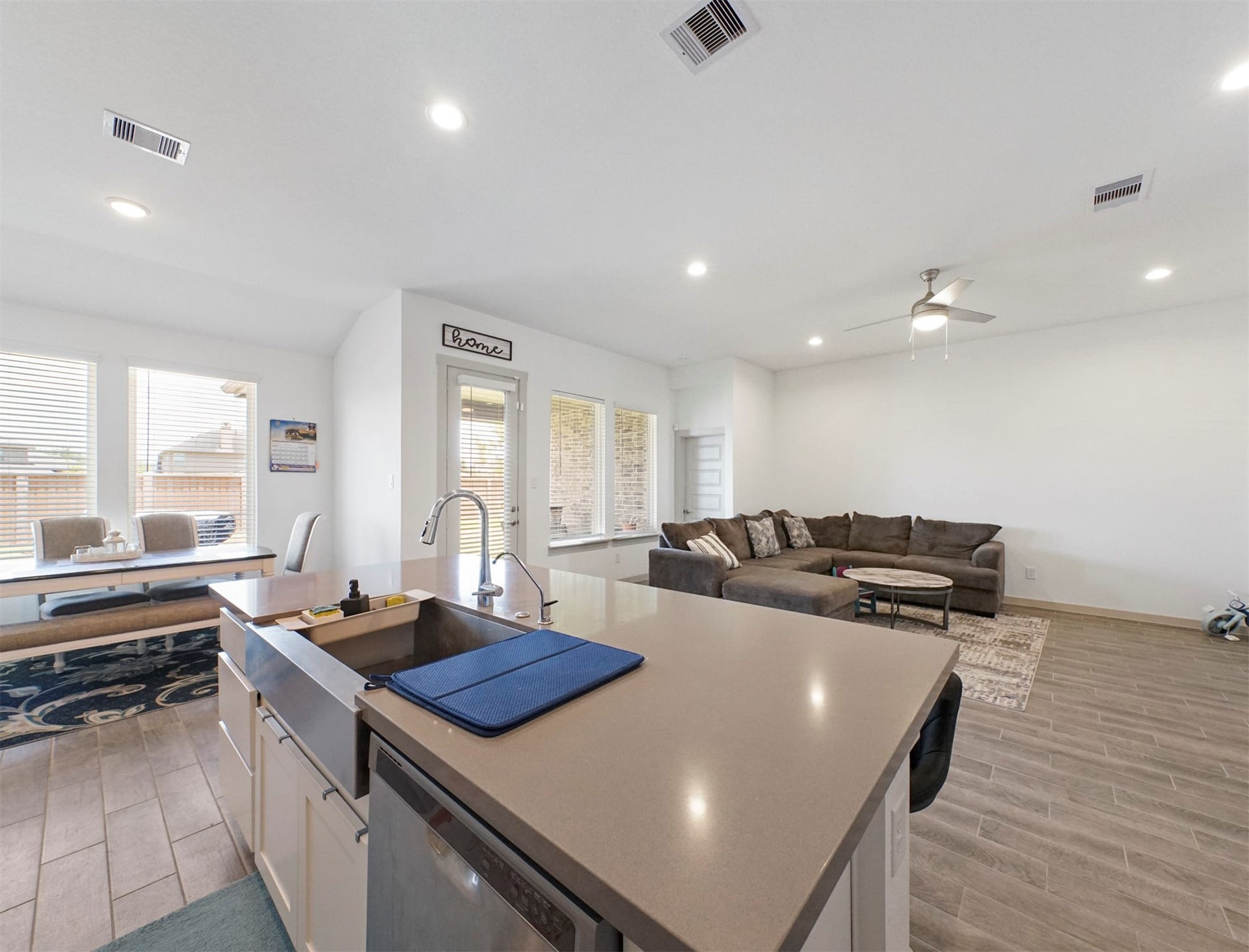 28226 Hazel Trail, Katy, TX 77494 The island holds a stainless farmhouse sink and a dishwasher, and it overlooks the dining area and living room.