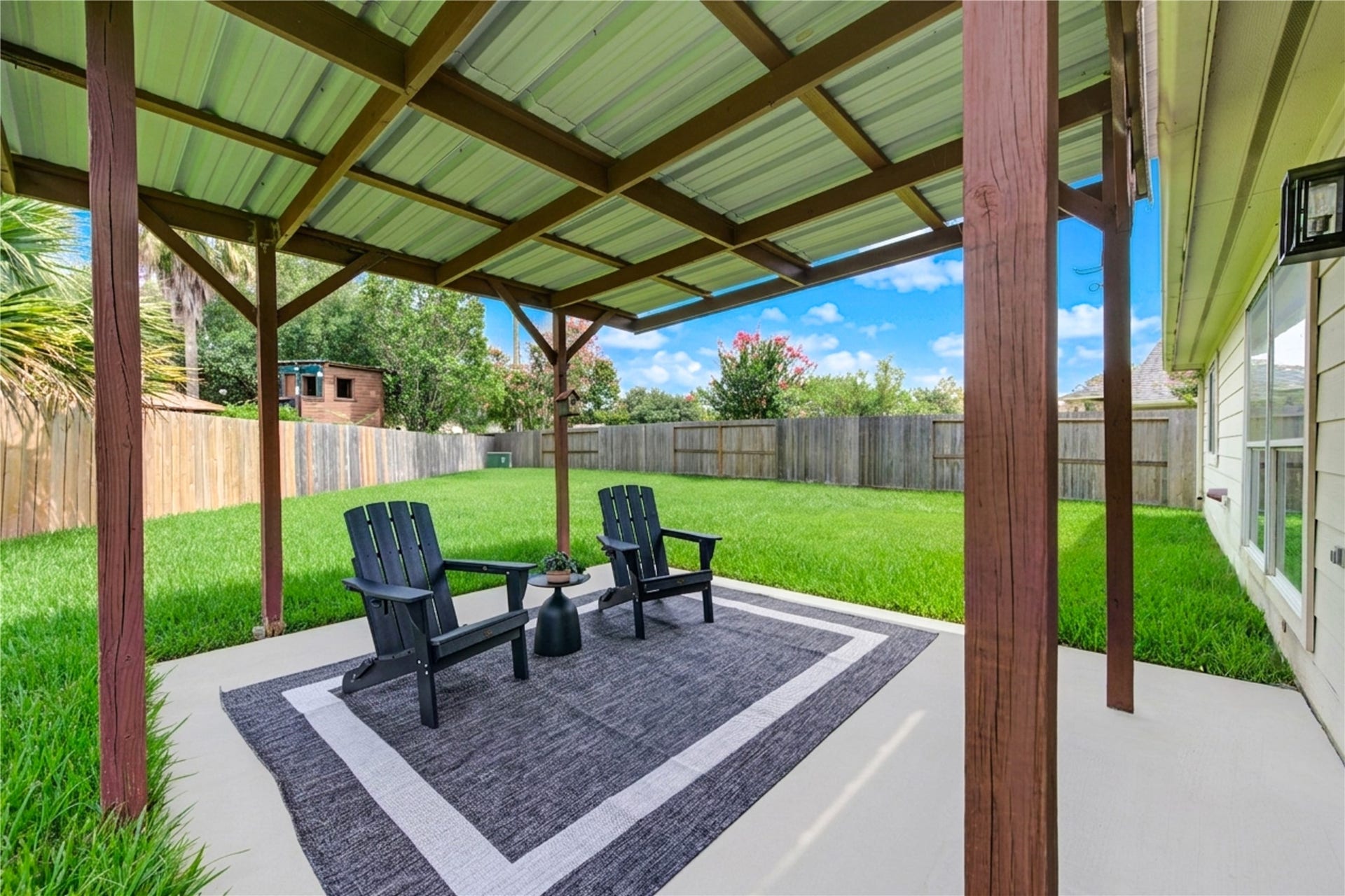 4931 Lake Catherine Court, Richmond, TX 77407 Enjoy evening conversations and weekend gatherings beneath the covered patio overlooking the expansive backyard
