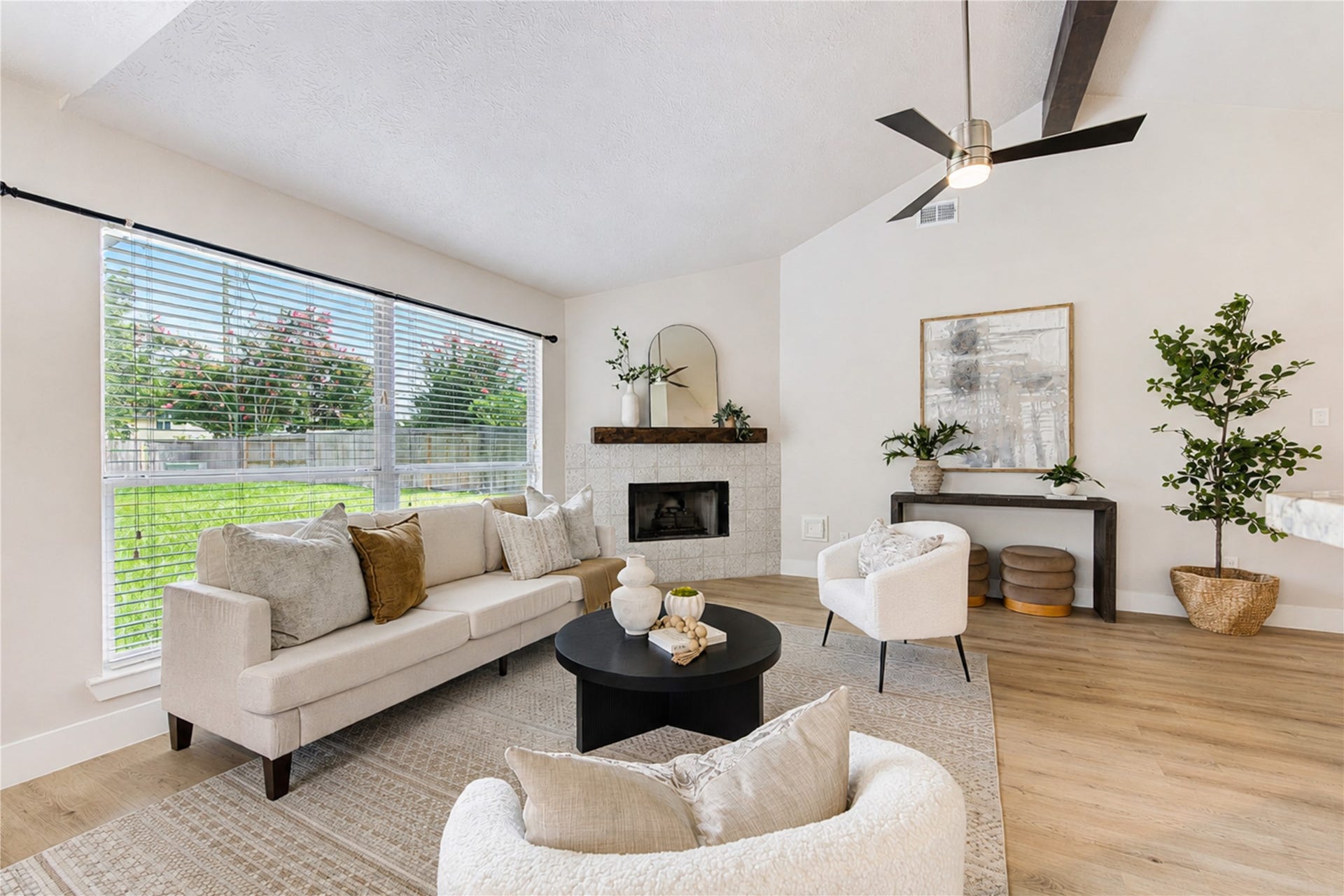 4931 Lake Catherine Court, Richmond, TX 77407 Envision gathering with family and friends in a light-filled living room anchored by a beautiful statement fireplace