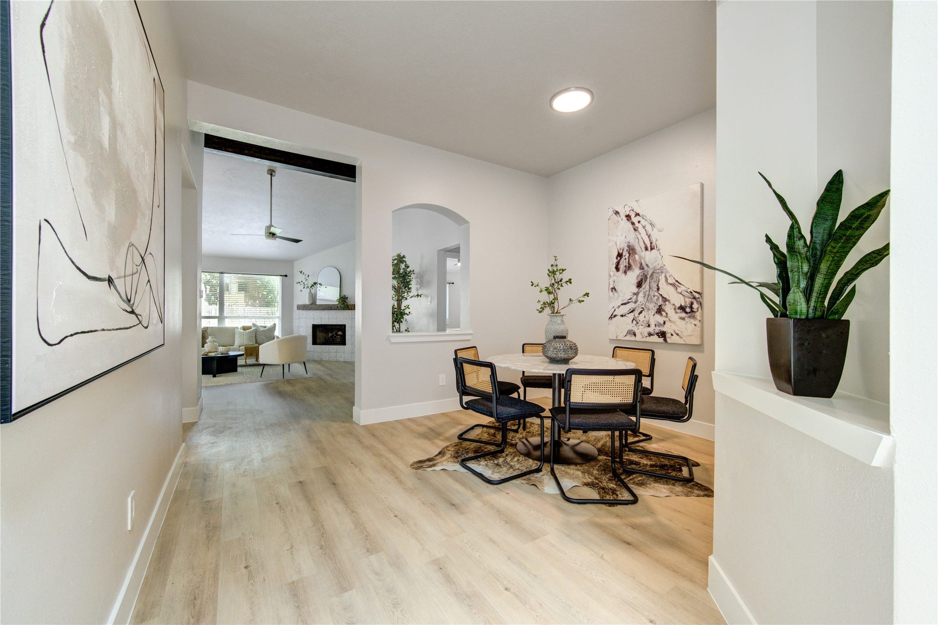 4931 Lake Catherine Court, Richmond, TX 77407 Staged to showcase a dining setting with an effortless flow into the living room