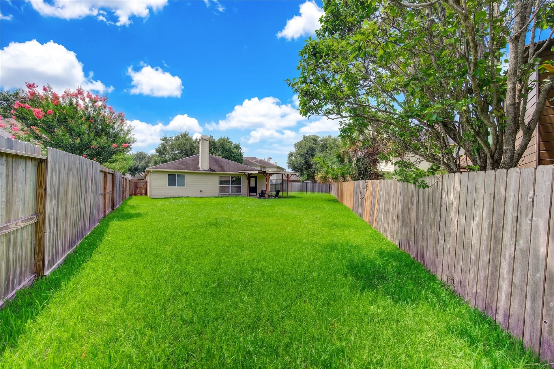 4931 Lake Catherine Court, Richmond, TX 77407 An expansive, fully fenced backyard offering abundant space for outdoor entertaining, recreation or creating your own private retreat