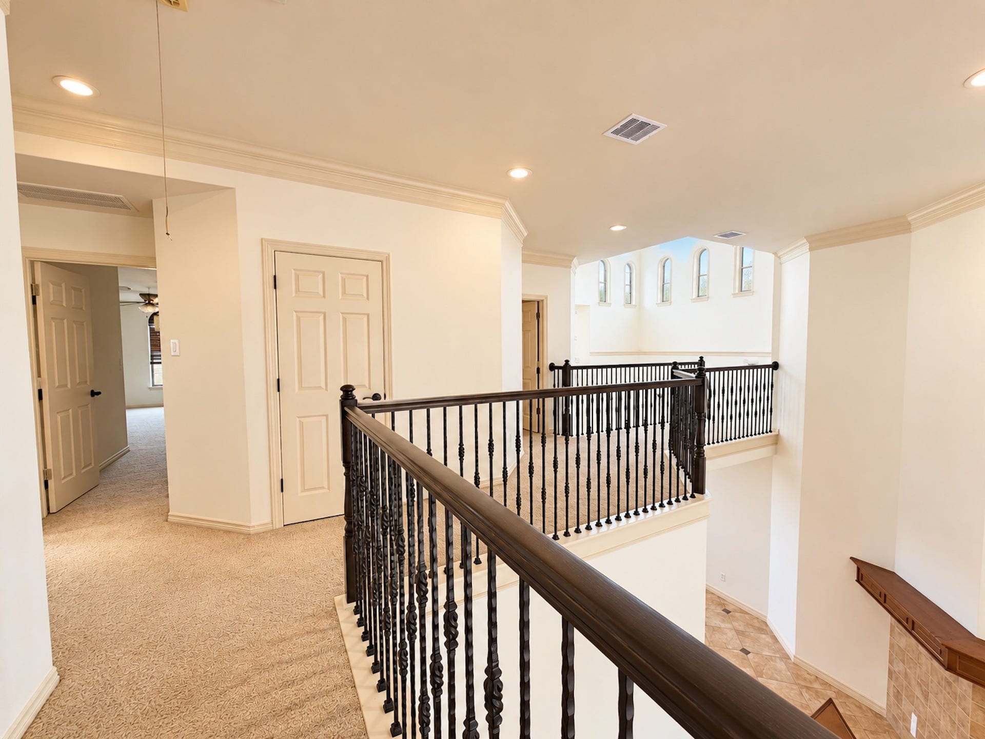 2514 Barcelona Way, League City, TX 77573 Upstairs landing with wrought-iron railing.