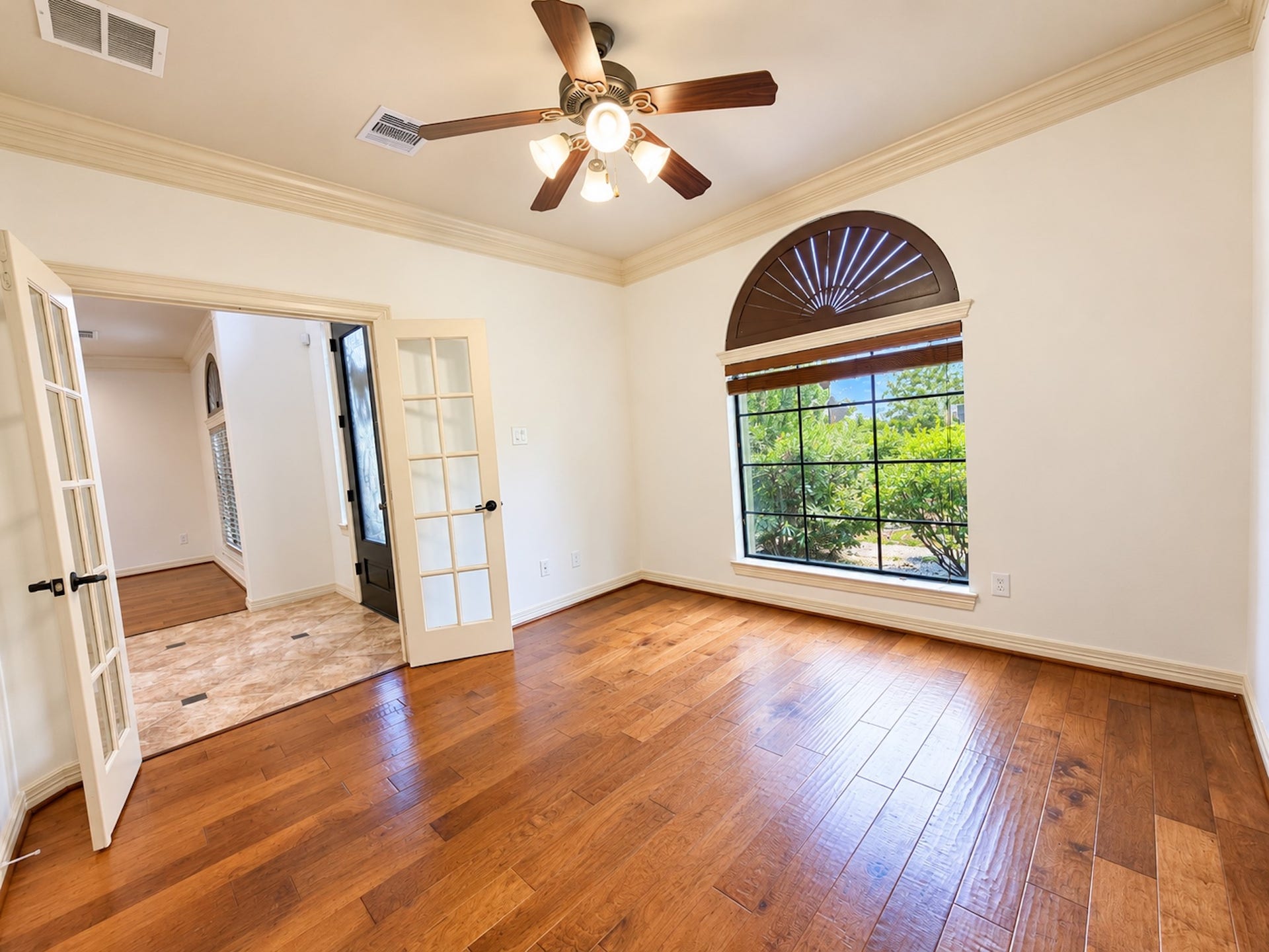 2514 Barcelona Way, League City, TX 77573 Study with French doors, wood floors and arched window.