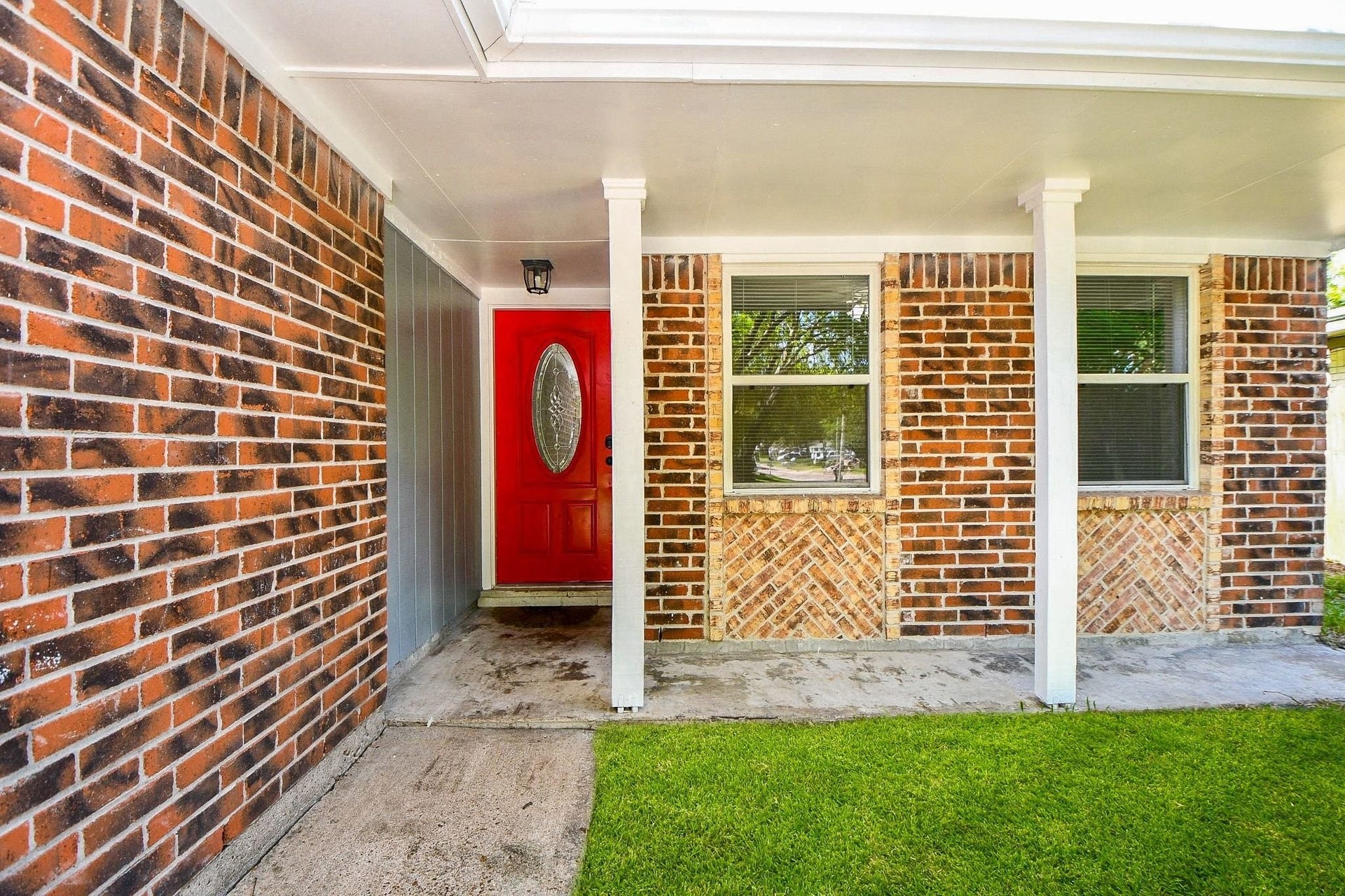 922 Bacliff Drive, Bacliff, TX 77518 Exceptional curb appeal begins here! Enjoy morning coffee on this spacious covered porch, accented by timeless brickwork, clean architectural pillars, and a bold red front door that makes a memorable first impression.