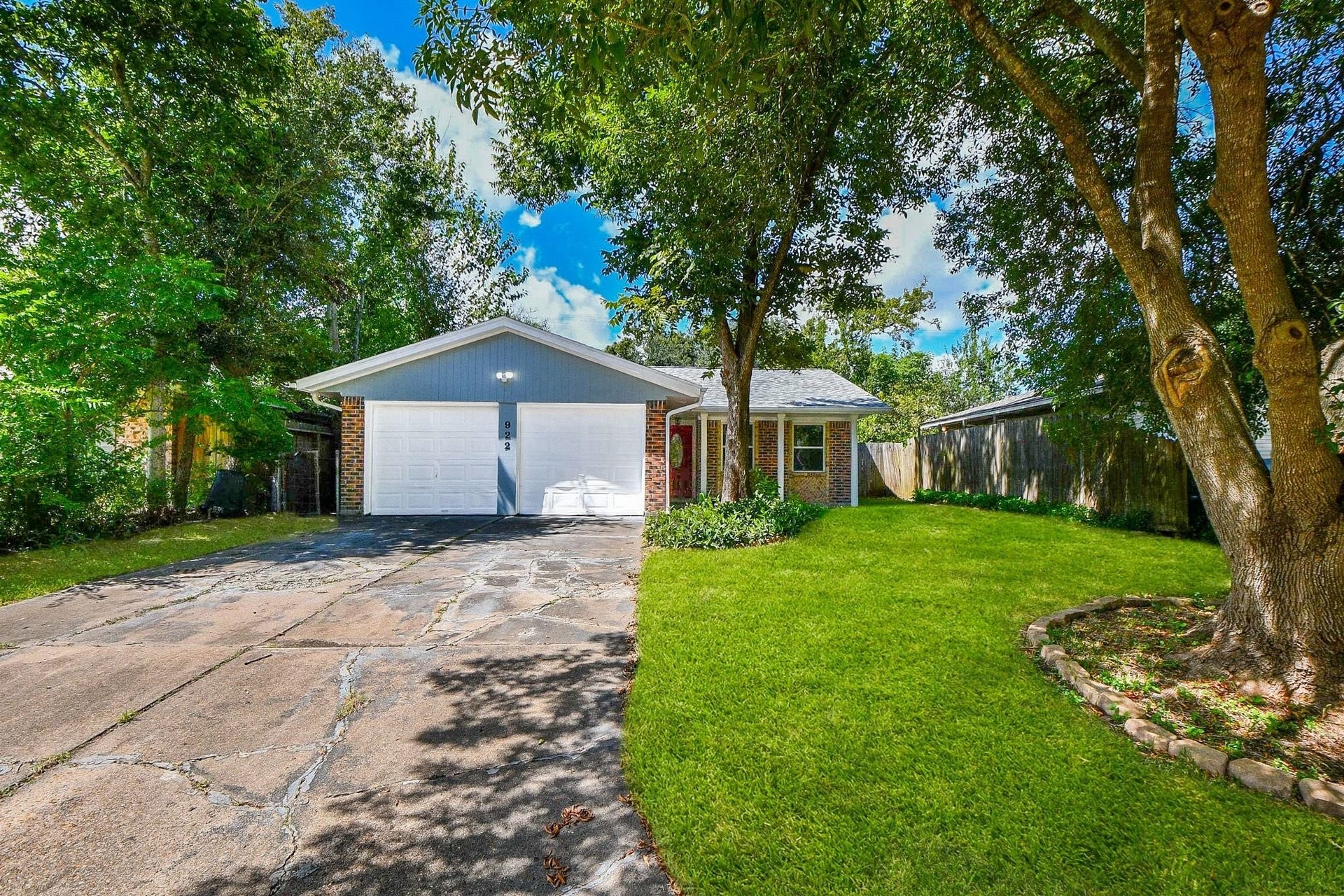 922 Bacliff Drive, Bacliff, TX 77518 Double wide driveway and a two-car garage anchors this home as a standout property. The option of only having to raise one door gives you access without sacrificing privacy. The garage has built in shelving for lots of storage space.