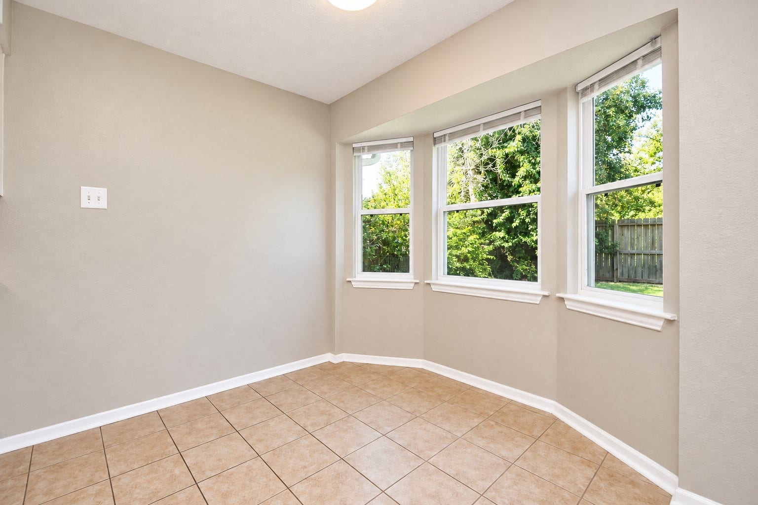 922 Bacliff Drive, Bacliff, TX 77518 A sun lit breakfast area framed by a charming trio of frames that were upgraded with brand new energy efficient double -pane windows overlooking the backyard.