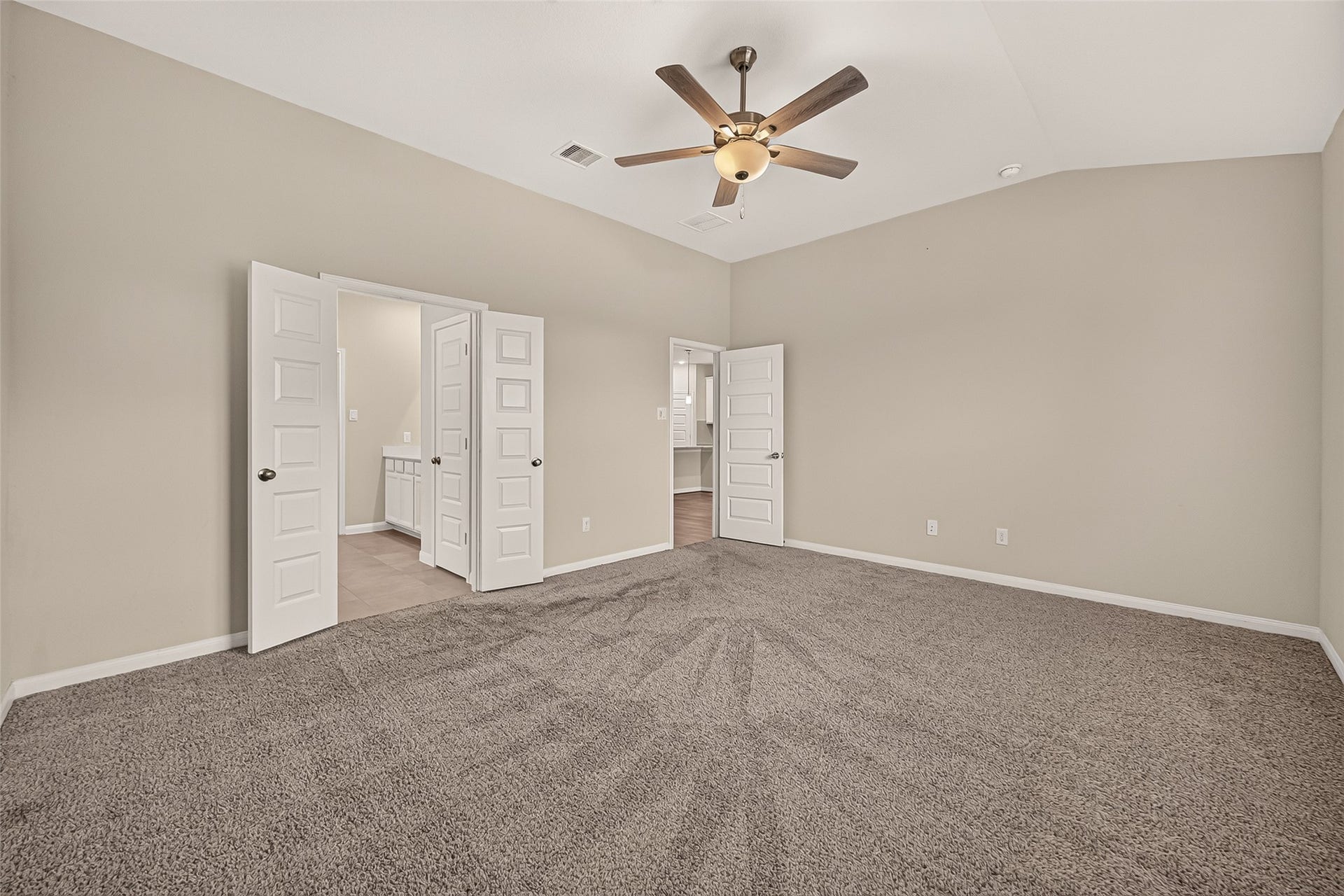 Discover the expansive owner's retreat, featuring ample space and elegant finishes for ultimate relaxation.