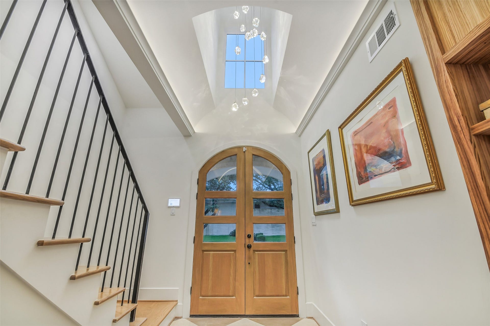 9411 Millbury Drive, Houston, TX 77096 One of a kind ceiling with picture window to show off the beautiful light fixture. Entry feature double doors offering seamless entry into the home.