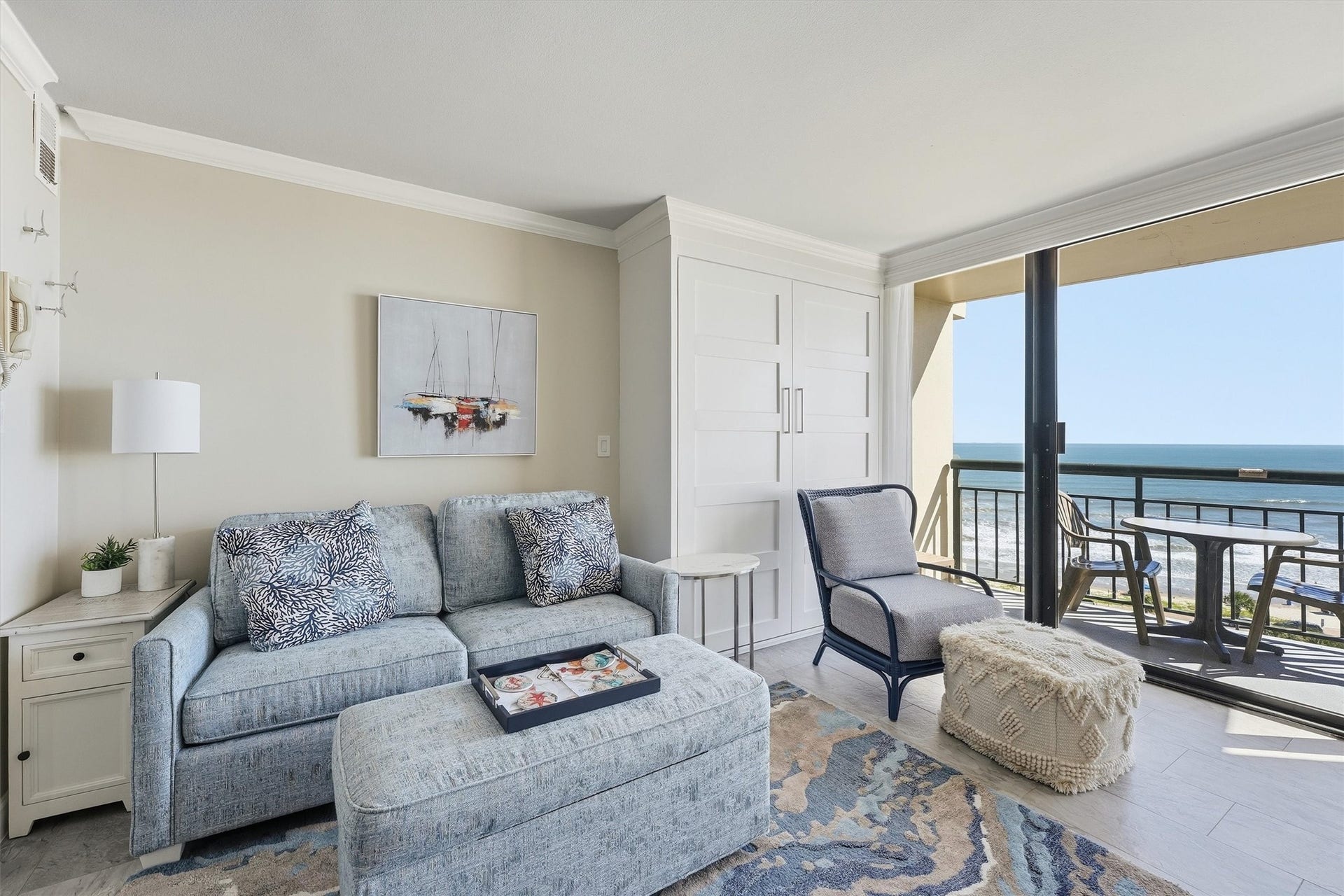 5220 Seawall Boulevard, #1038D, Galveston, TX 77551 Relax in the inviting living area while taking in the Gulf through expansive sliding glass doors.