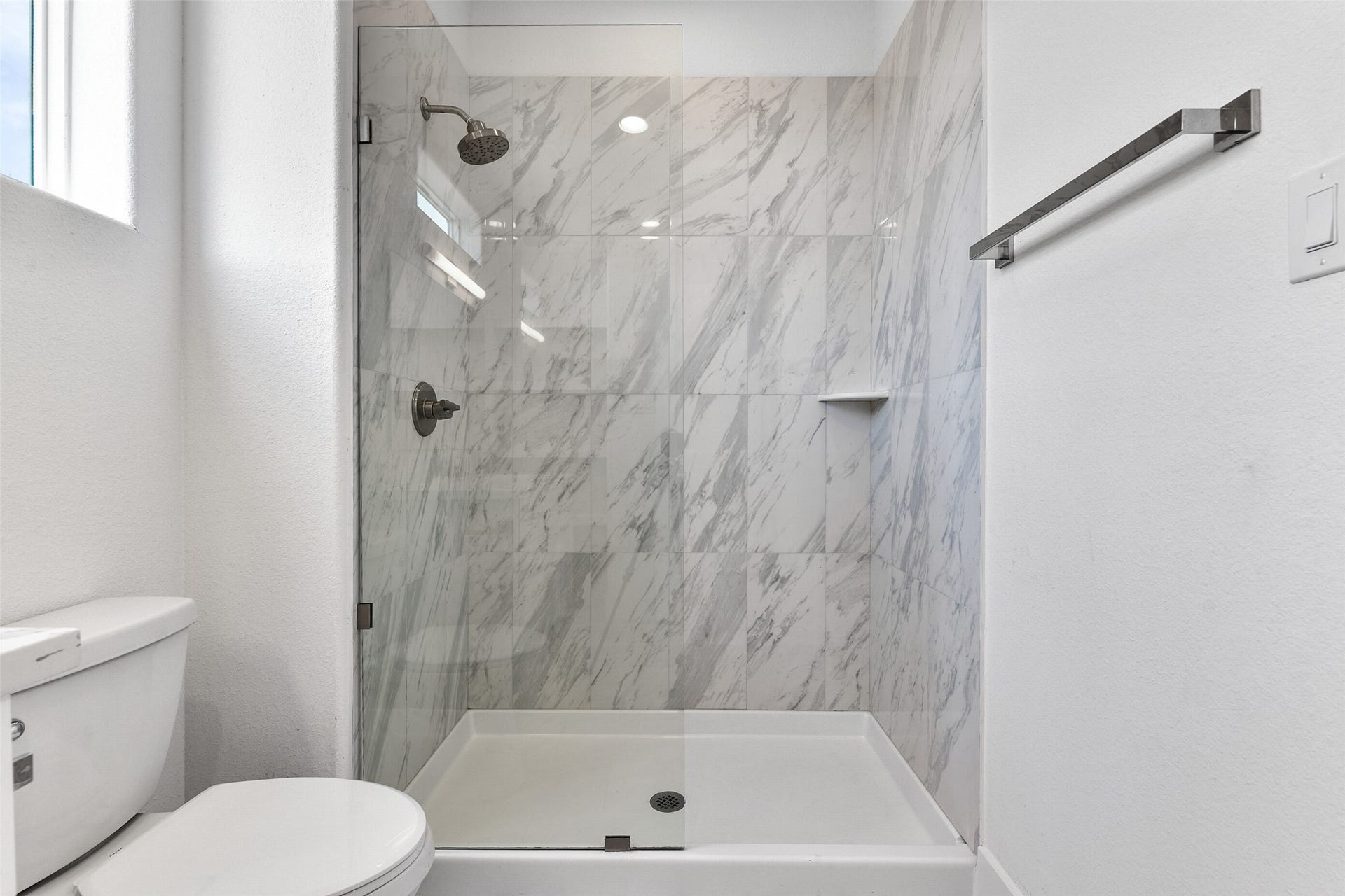 4006 Fort Bend Drive, Galveston, TX 77554 The tile work is beautiful in the walk-in shower.
