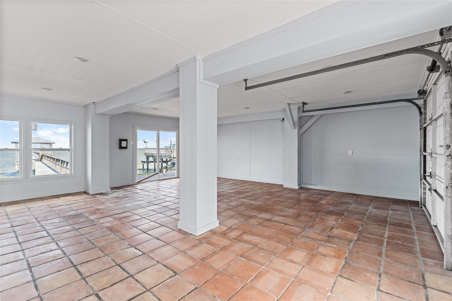 645 3rd Street, San Leon, TX 77539 With ample room to gather, dine, and unwind, this expansive lower level offers the flexibility to function as an additional living and entertaining space while maintaining convenient access to the outdoors.