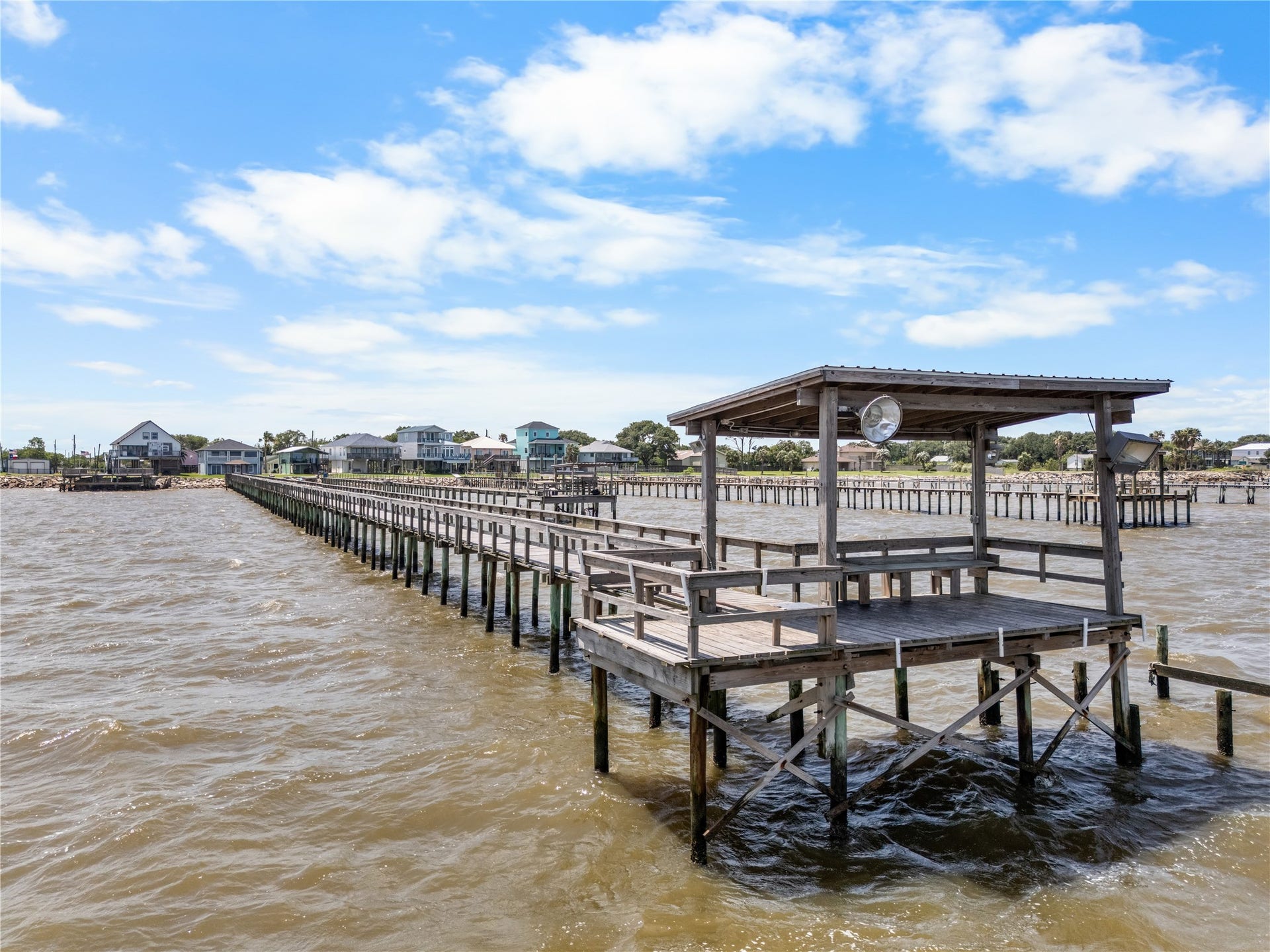 645 3rd Street, San Leon, TX 77539 More than a pier, it's a destination. Complete with a covered sitting area, this private dock invites slow mornings, sunset conversations, and endless days on the water.