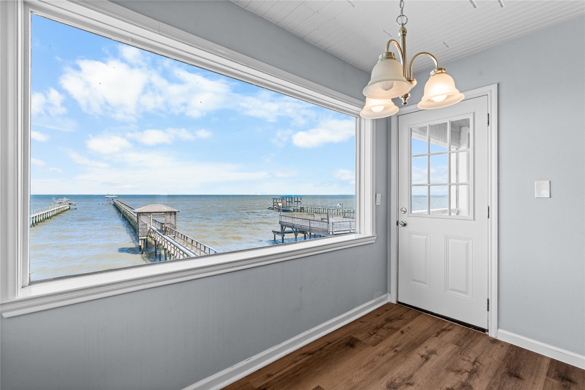 645 3rd Street, San Leon, TX 77539 Positioned to capture uninterrupted bay views, the dining area transforms every meal into a waterfront experience.