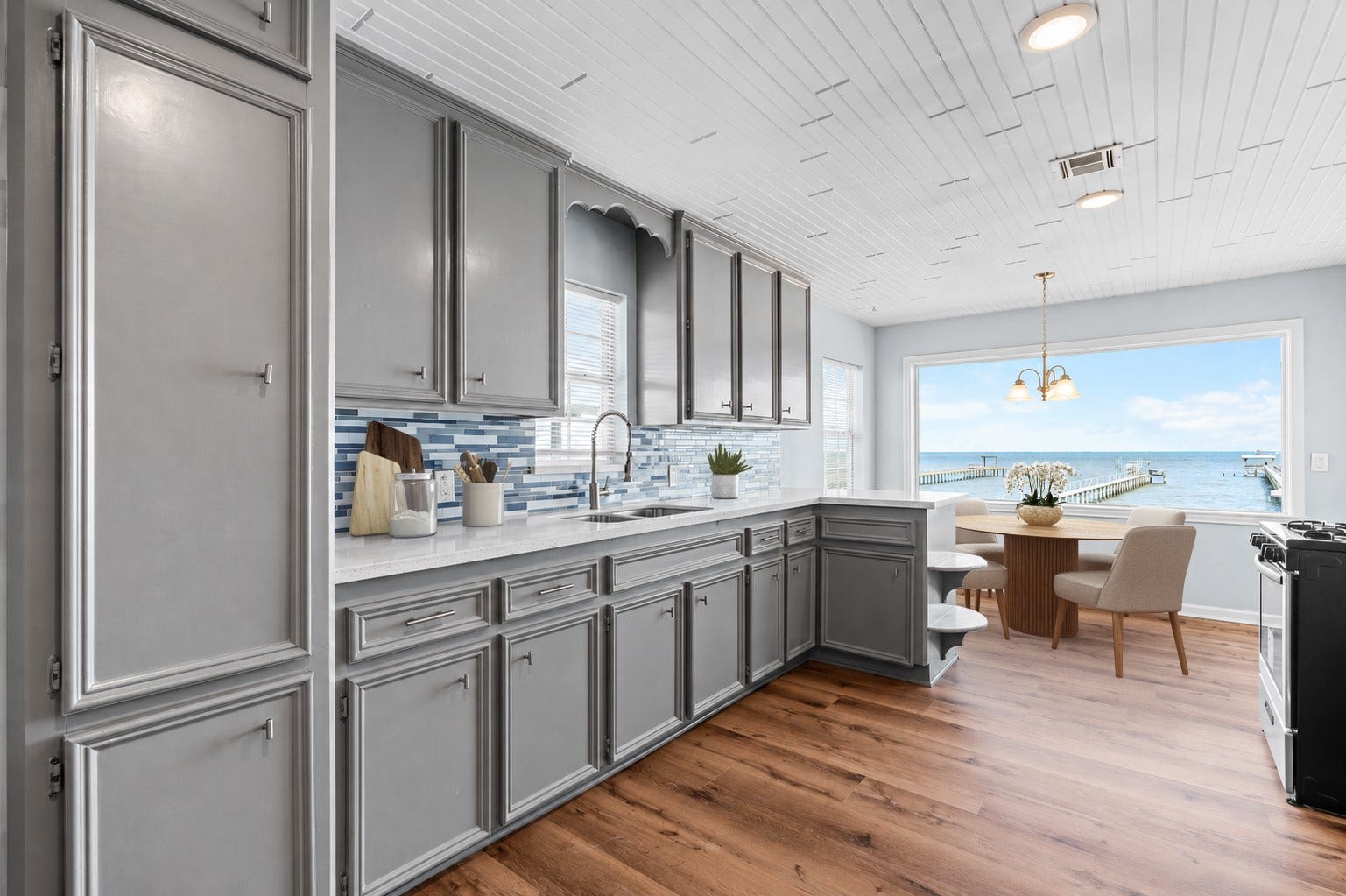 645 3rd Street, San Leon, TX 77539 Positioned to capture sweeping waterfront vistas, this light-filled dining area invites you to slow down and savor the scenery.