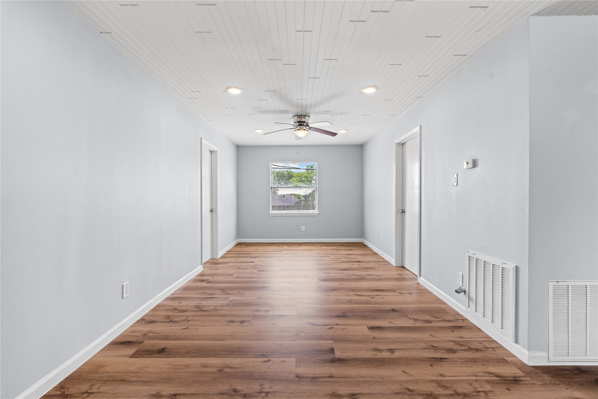 645 3rd Street, San Leon, TX 77539 Thoughtfully connected living spaces create an effortless flow from the living room to the kitchen, making everyday living and entertaining feel seamless.