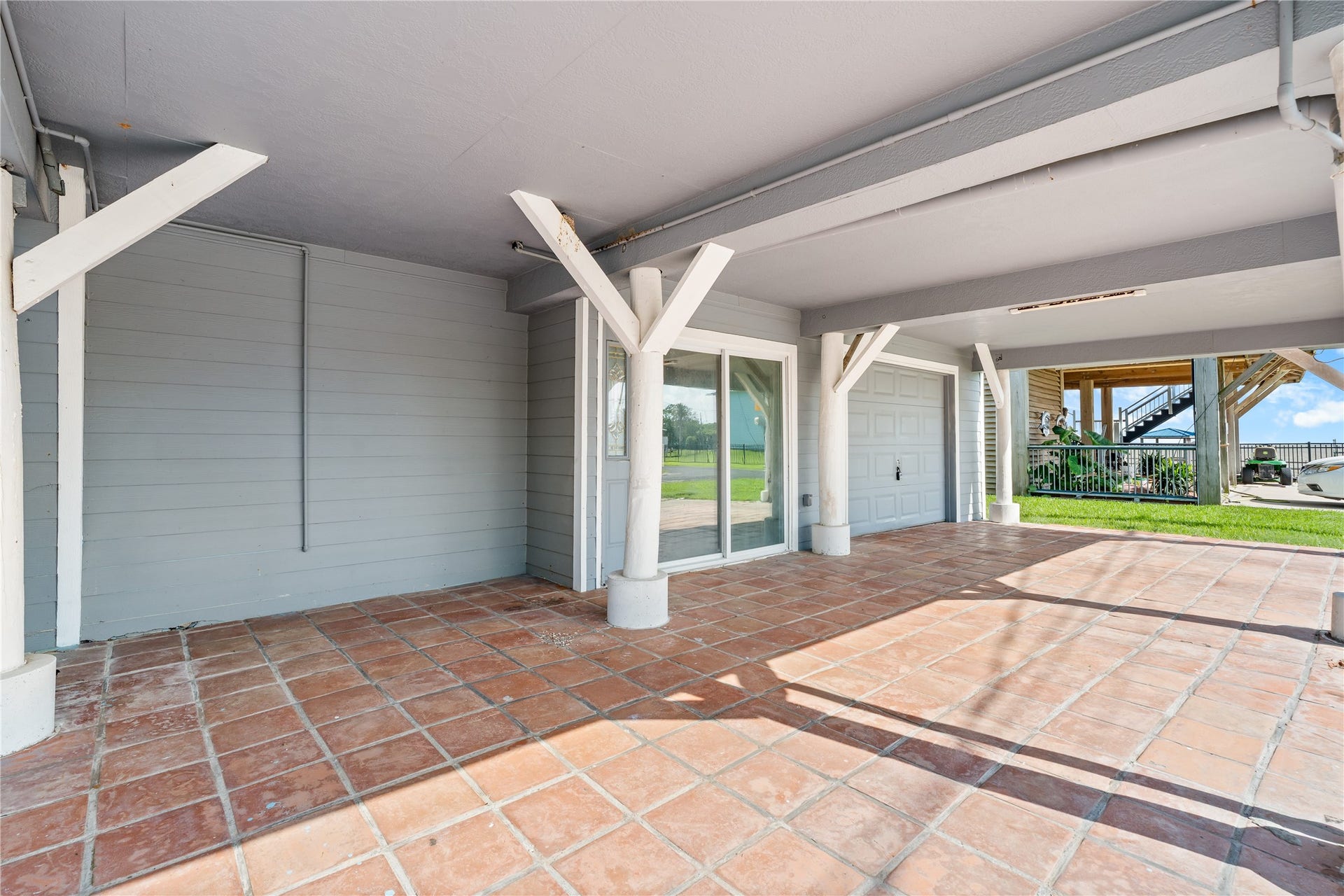 645 3rd Street, San Leon, TX 77539 The expansive covered area beneath the home creates a versatile extension of the living space, perfect for entertaining, storing gear, or simply enjoying the shade after a day on the water.