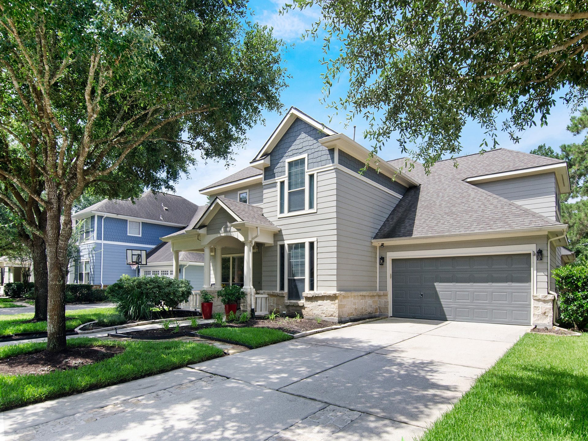 Mature trees frame this attractive exterior, complimented by fresh paint (2022) a new roof (2023) and an oversized garage. A home you'll be proud to call your own!