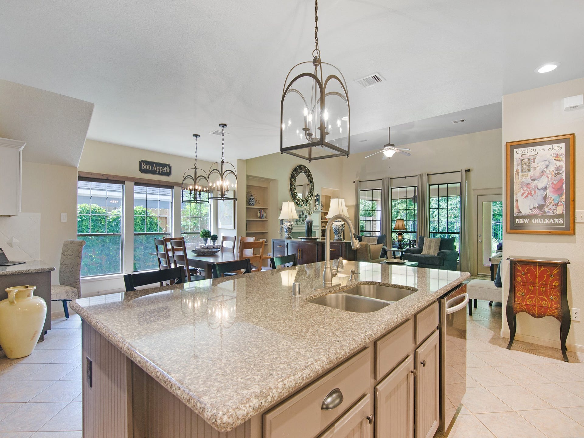 From morning coffee to family dinners, the seamless flow between the kitchen and adjoining living spaces keeps everyone connected.