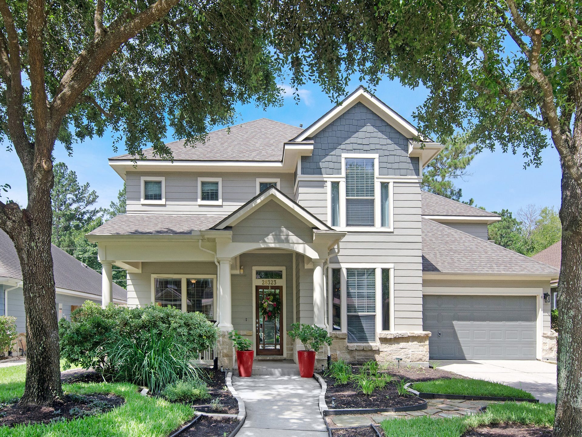 This beautiful, well maintained family home welcomes you with exceptional curb appeal, highlighted by a charming covered front porch, attractive stone accents, mature landscaping and recent exterior improvements including, paint and new roof. The oversized two-car garage provides generous space for storage, hobbies and everyday convenience.