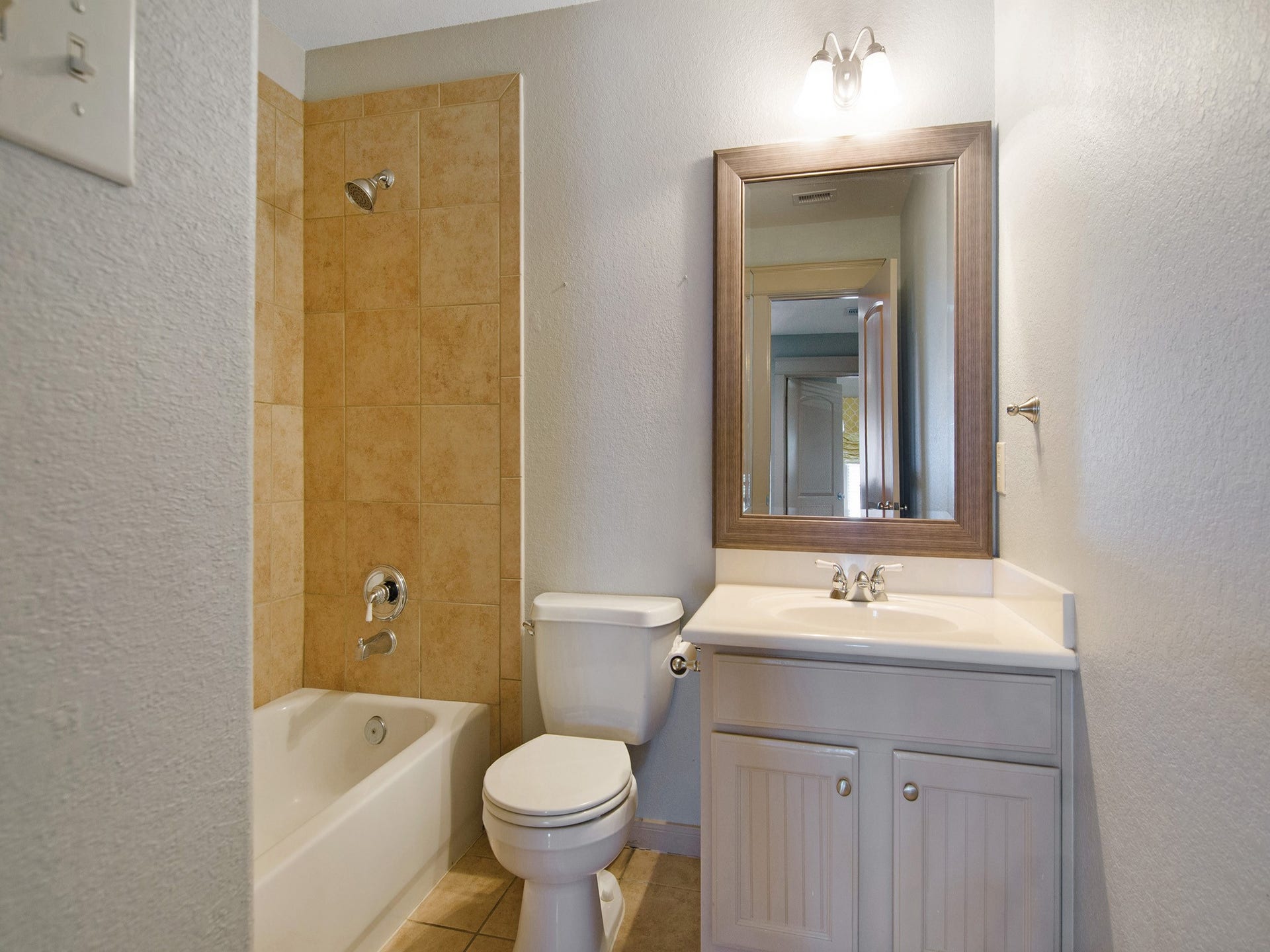 Full bath with tub & shower combo, conveniently serving the upstairs bedrooms.