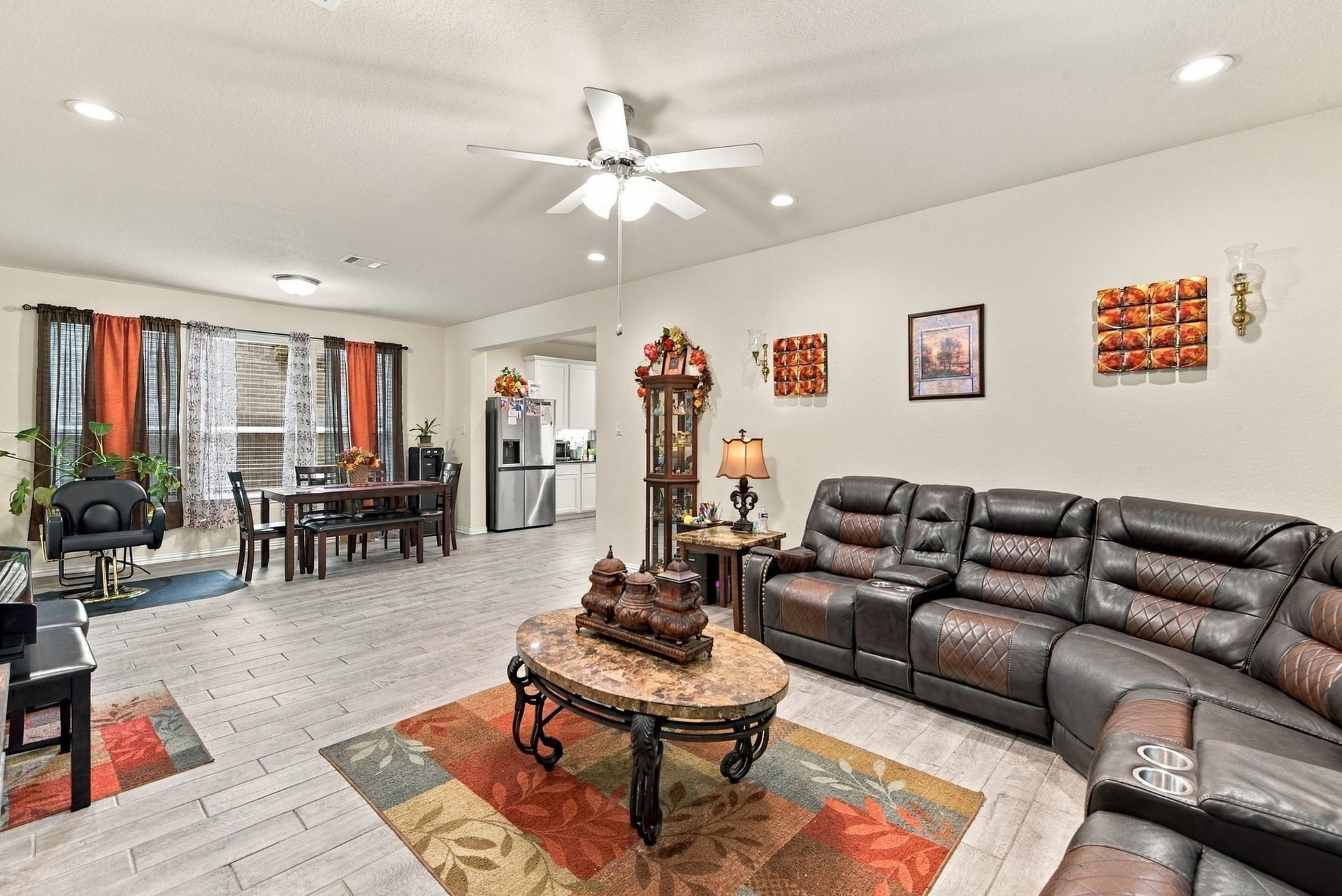 13202 Dancing Reed Drive, Texas City, TX 77568 Spacious living area, seamlessly connected to a dining space with abundant natural light.