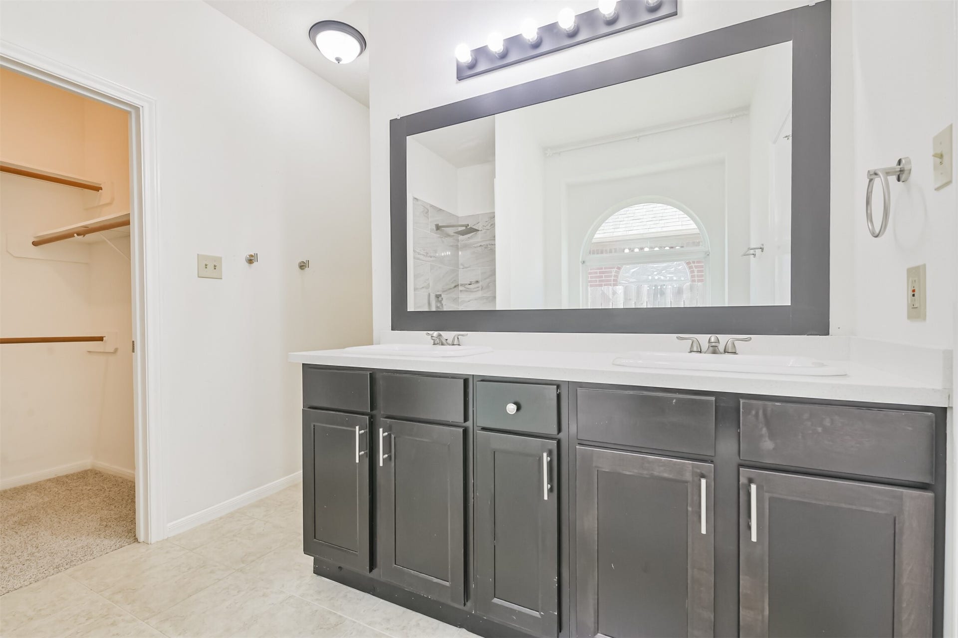 17527 Glenwolf Drive, Houston, TX 77084 Primary Bathroom w/ Updated Cabinets and Mirror