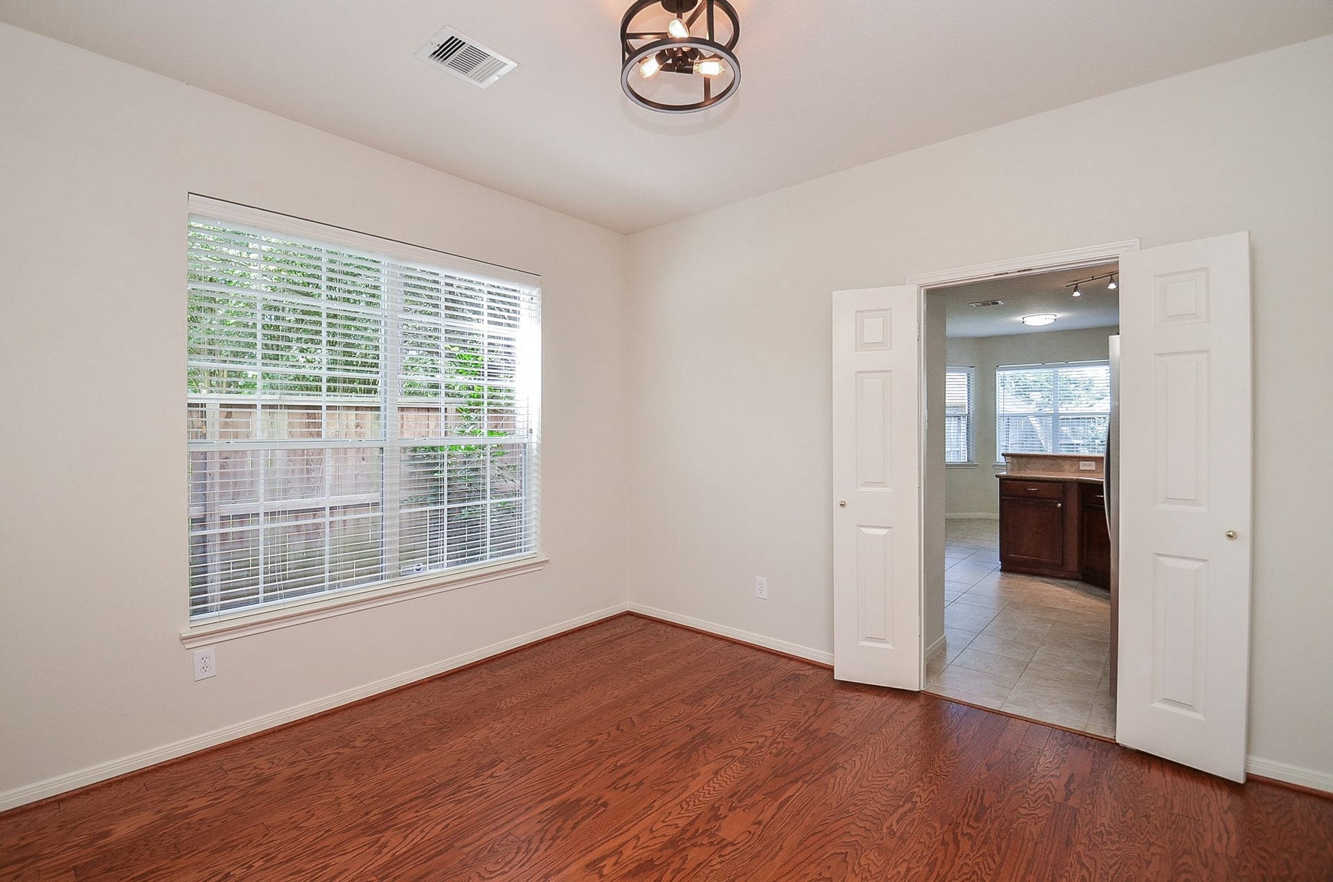 4746 Autumn Orchard Lane, Katy, TX 77494 Bright and inviting, this dining room offers an abundance of natural light through large windows, creating the perfect setting for memorable gatherings.