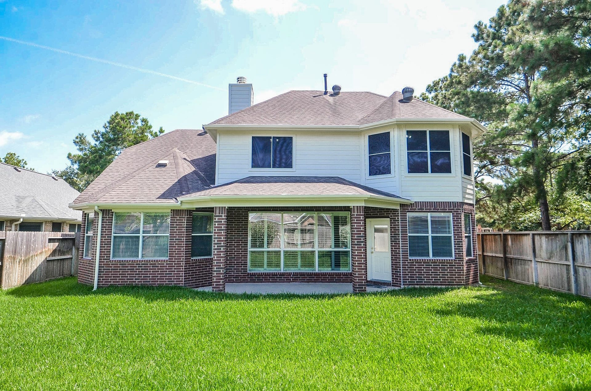 4746 Autumn Orchard Lane, Katy, TX 77494 Spacious home nestled on a large, lush lot with mature trees and a fenced backyard, offering ample privacy and outdoor space.