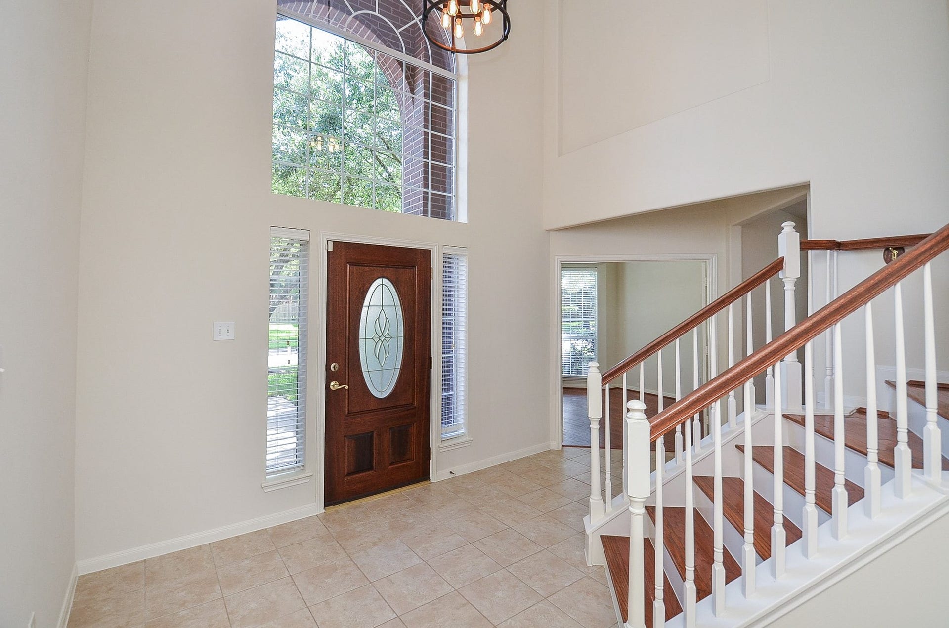 4746 Autumn Orchard Lane, Katy, TX 77494 Experience elegance with a grand entryway leading to a bright, inviting room featuring French doors and expansive bay windows.