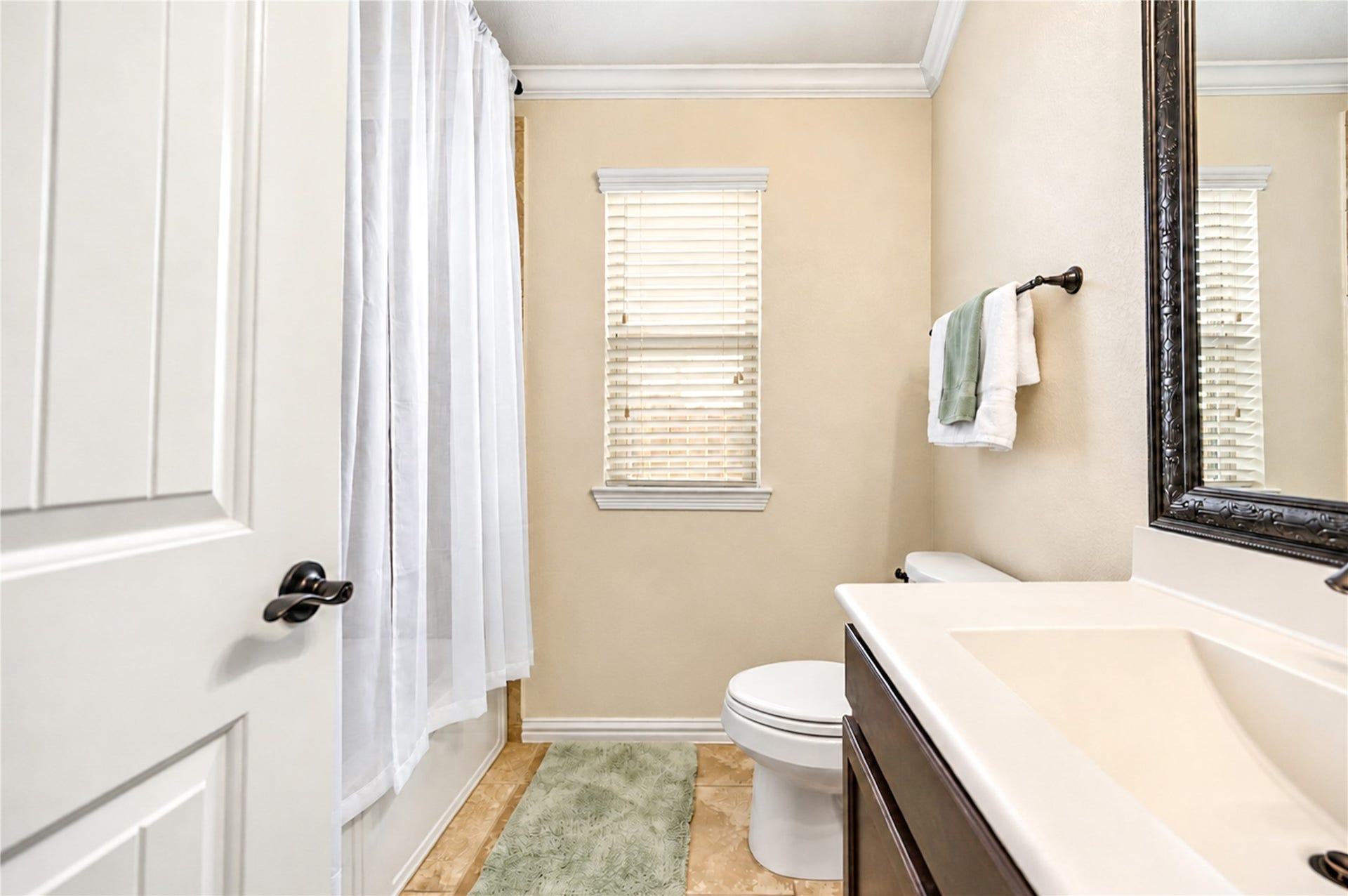 16719 Cactus Blossom Trail, Cypress, TX 77433 The secondary bath includes a tub and shower combination with a single vanity.