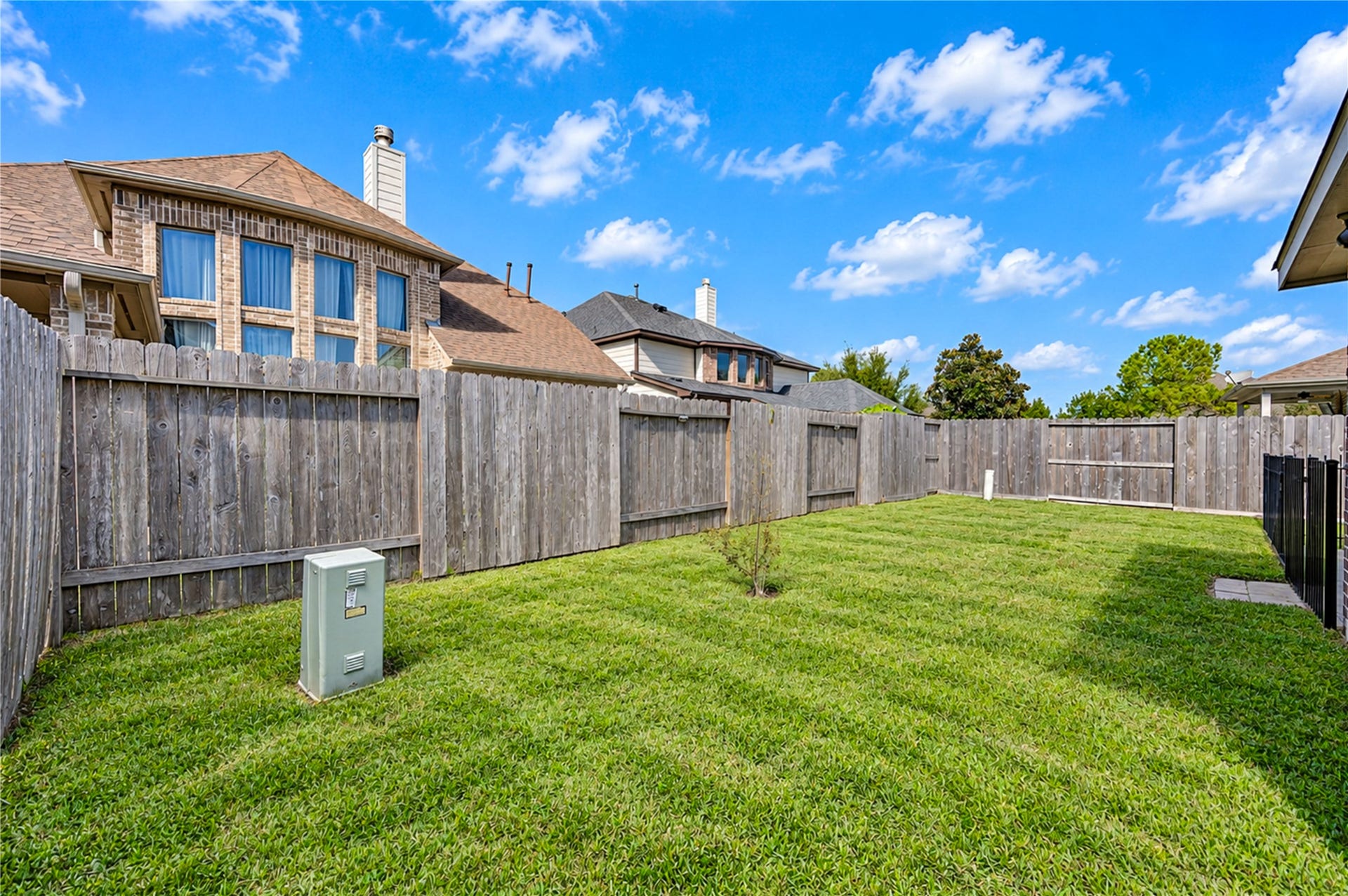 16719 Cactus Blossom Trail, Cypress, TX 77433 A wood privacy fence surrounds the open backyard, with room to garden or add a pool.