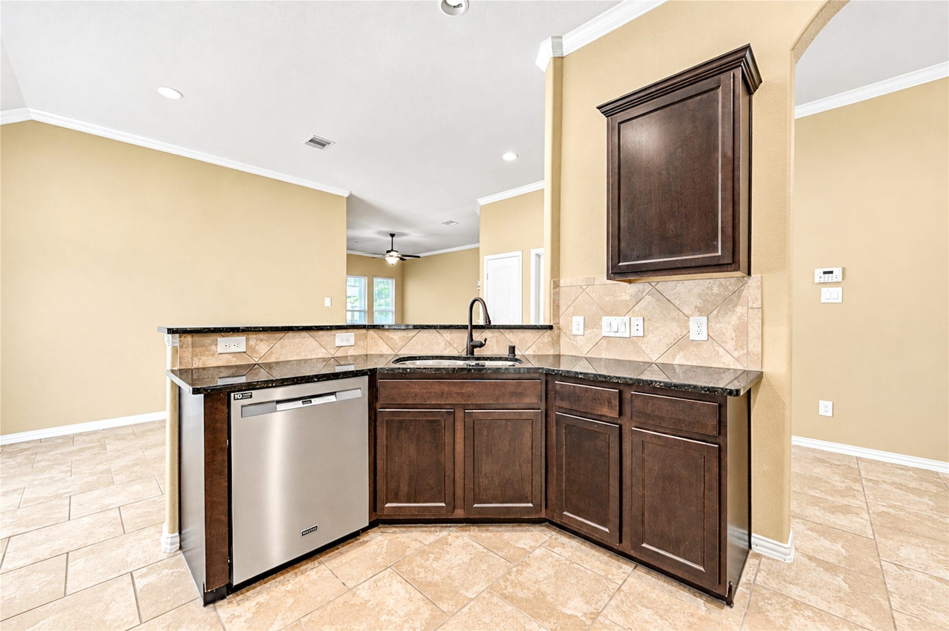 16719 Cactus Blossom Trail, Cypress, TX 77433 A granite peninsula with an undermount sink wraps the kitchen and keeps the cook connected to the living area.