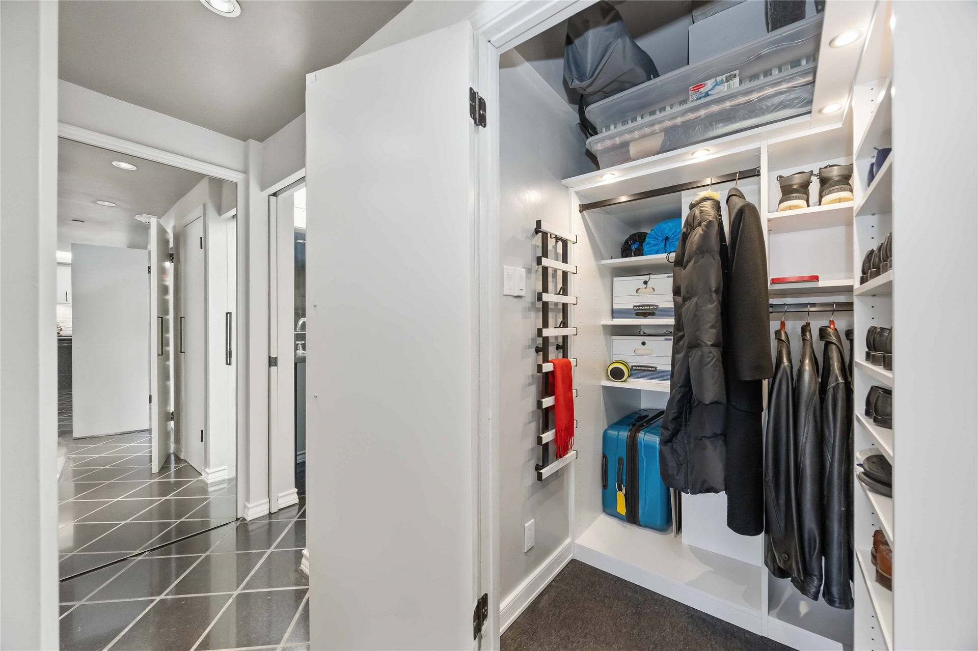 5000 Montrose Boulevard, #6A, Houston, TX 77006 The walk-in closet is outfitted with custom shelving, hanging space, and drawers, fully customized by California Closets.