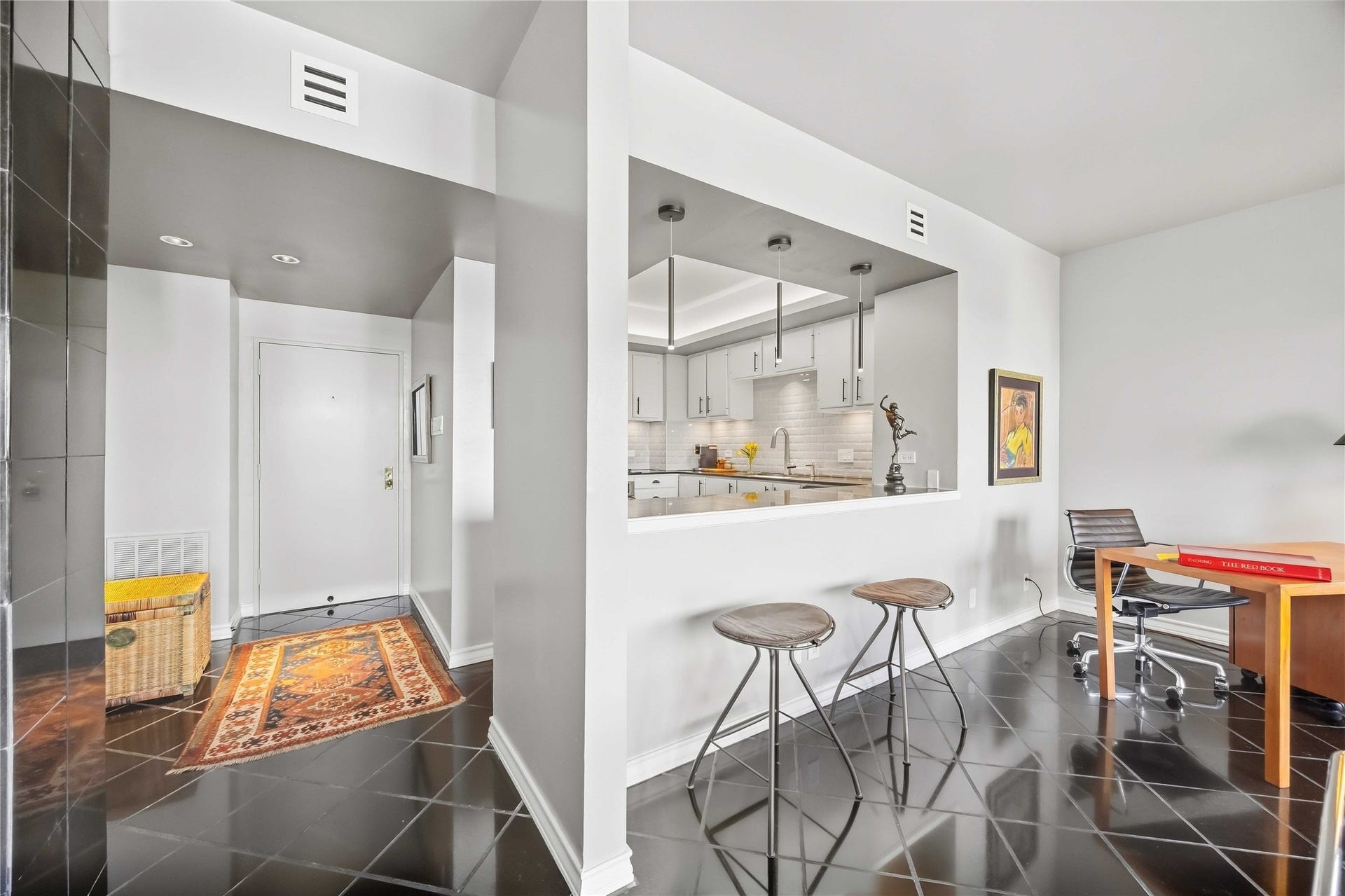 5000 Montrose Boulevard, #6A, Houston, TX 77006 A pass-through opening connects the kitchen to the living area, with a breakfast bar for casual meals.
